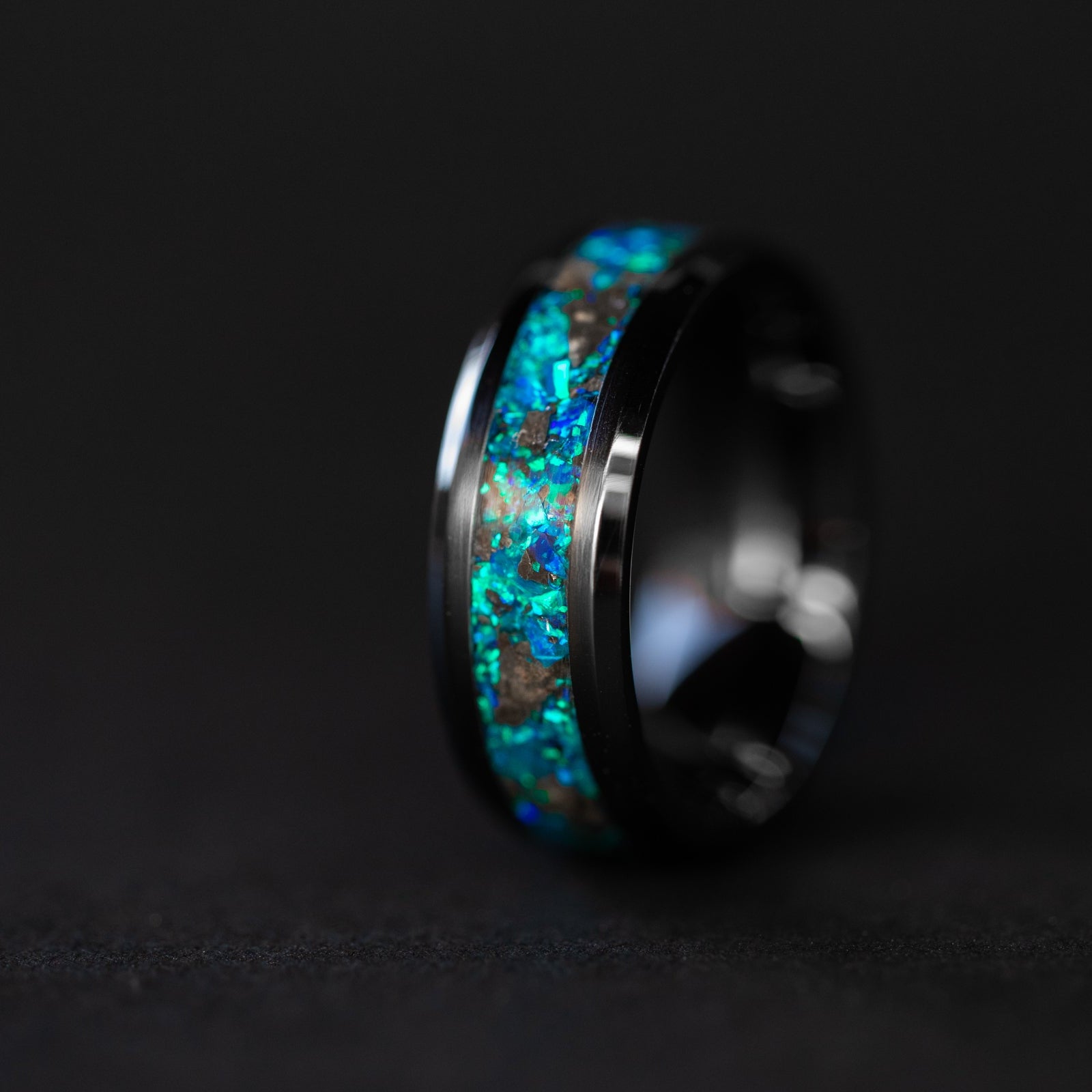 8mm beveled black ceramic ring with authentic lunar meteorite fragments suspended in blue opal inlay
