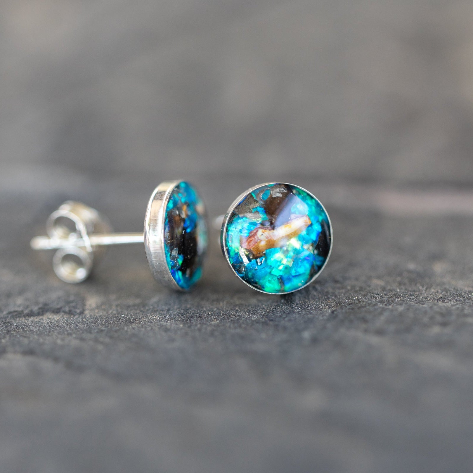 Authentic Campo Del Cielo meteorite and real velociraptor bone stud earrings with blue opal in sterling silver. Handcrafted real dinosaur fossil jewelry from our California studio.