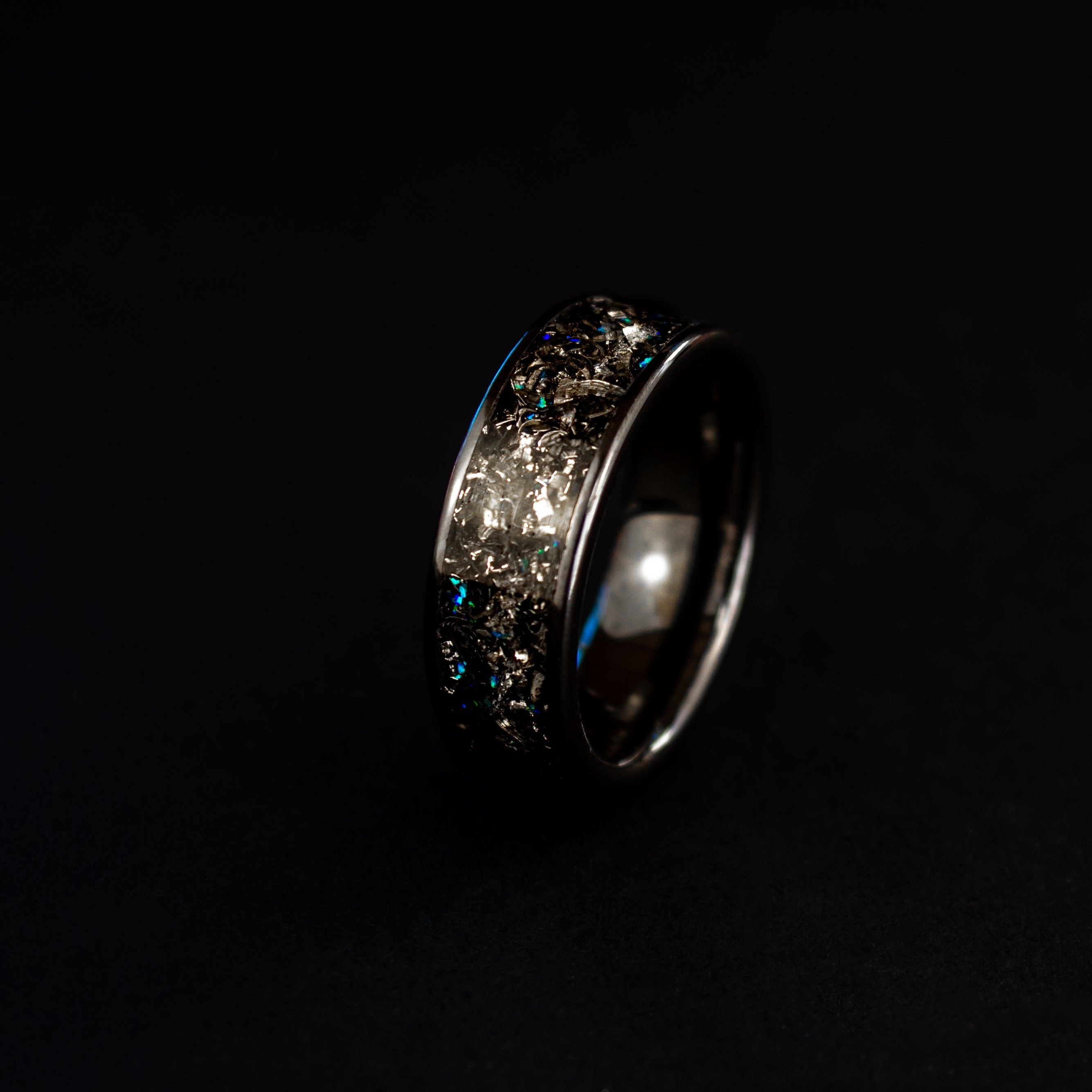 8mm wide channel black ceramic ring with authentic Campo del Cielo meteorite shavings and blue opal accents