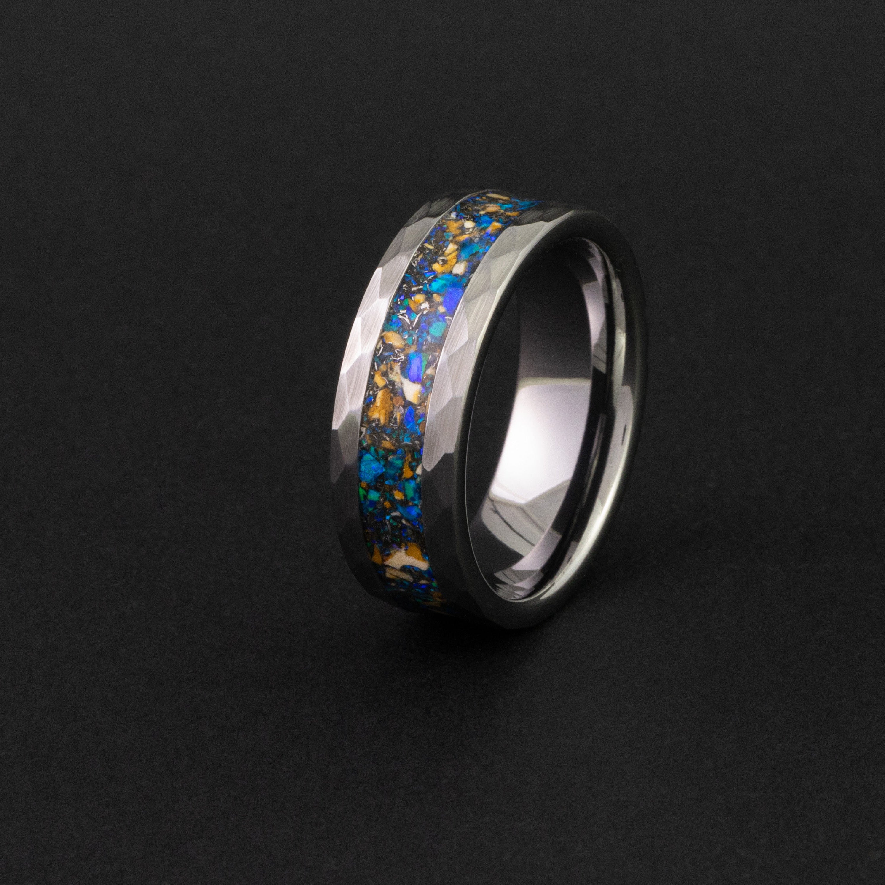 Handcrafted Velociraptor bone and meteorite ring with blue fire opal in a hammered silver tungsten band.