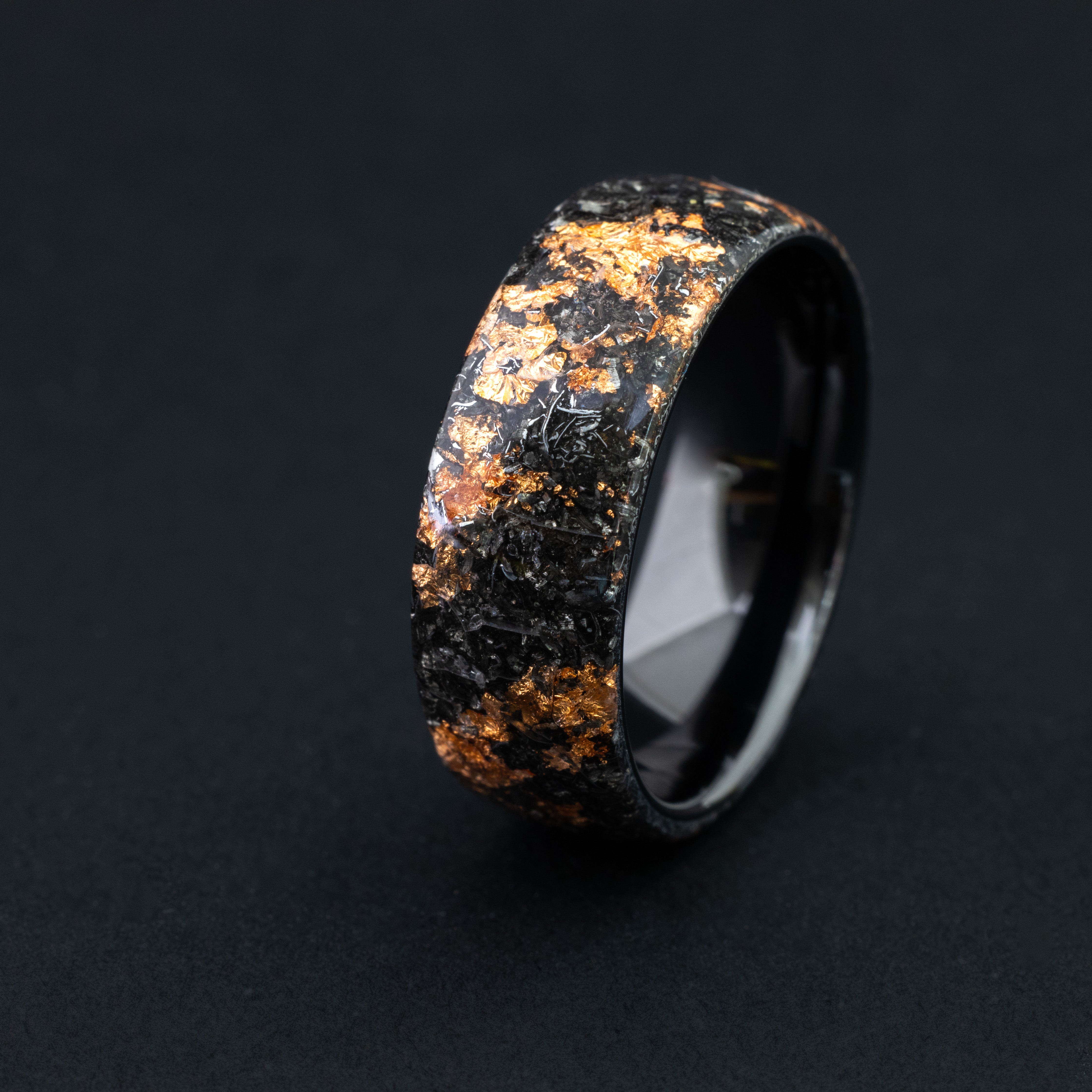 Handcrafted seamless black ceramic ring with authentic Campo meteorite and copper flake inlay.