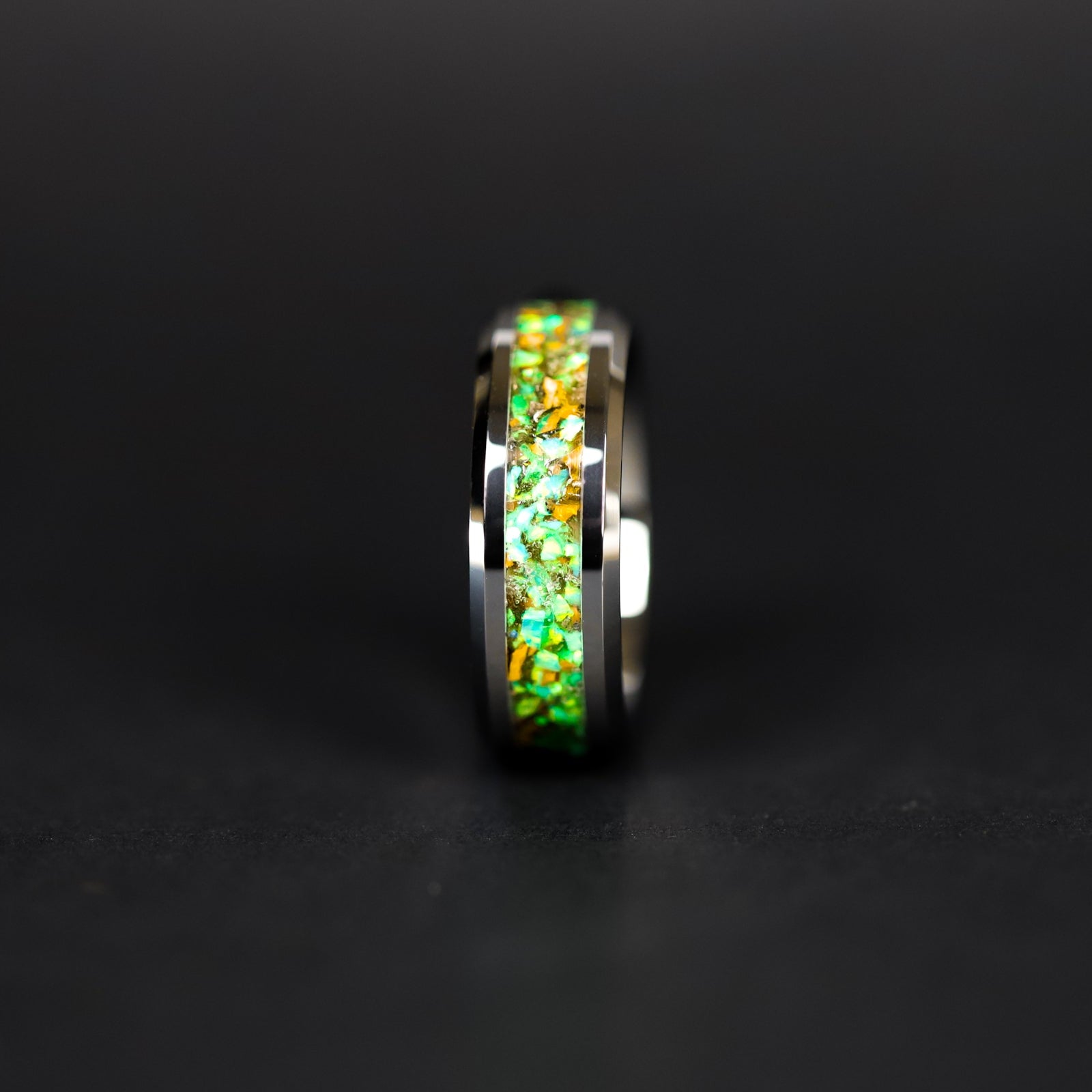 Handcrafted 6mm tungsten wedding band with authentic Velociraptor bone and Campo del Cielo meteorite in lime green opal green glow inlay made in California