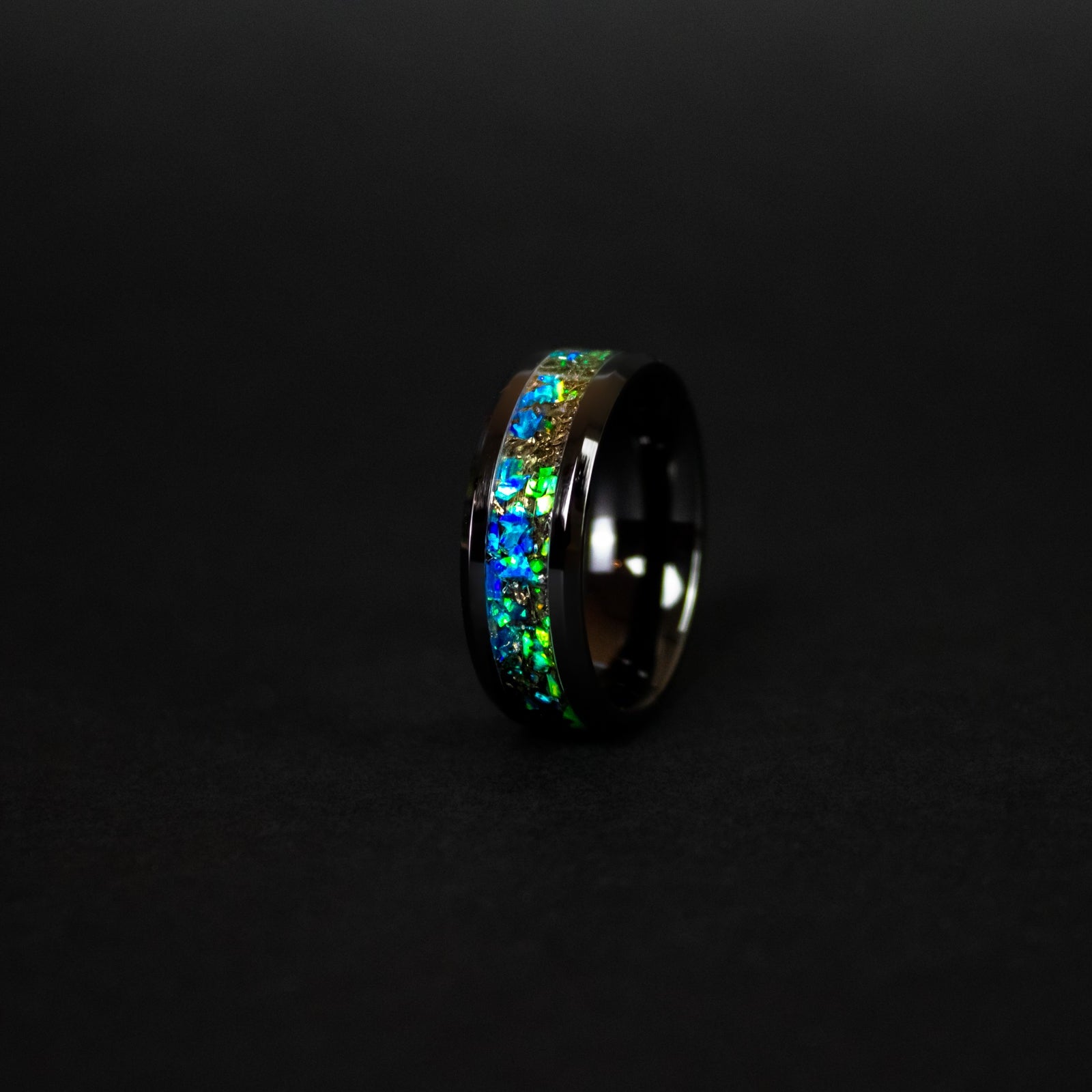 8mm beveled black ceramic ring with authentic Campo del Cielo meteorite shavings in split blue and green opal inlay