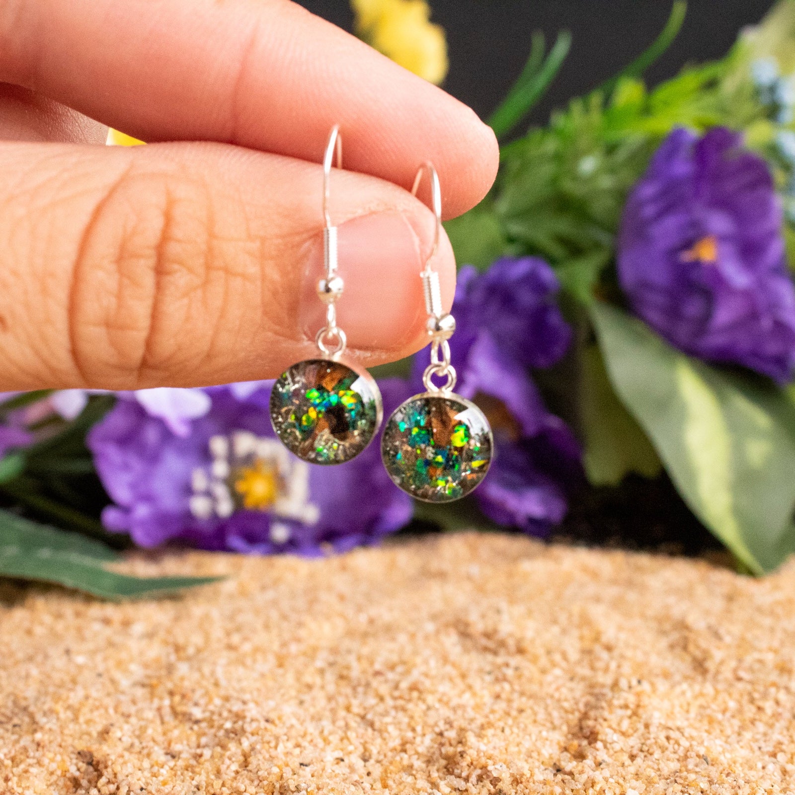 Handcrafted tyrannosaurus rex fossil silver dangle earrings with Campo Del Cielo meteorite, real dinosaur bone, and green opal inlay