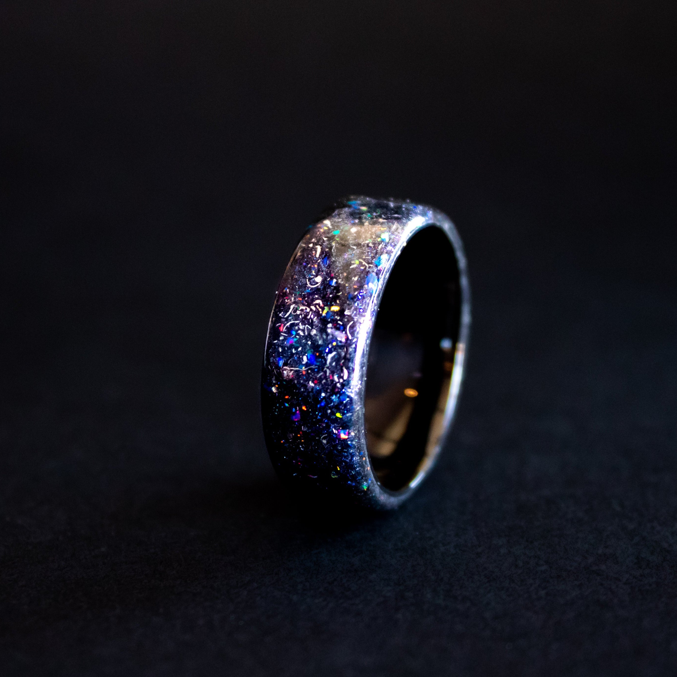 Endless black ceramic ring with authentic Campo del Cielo meteorite shavings in blue and purple opal galaxy pigment inlay