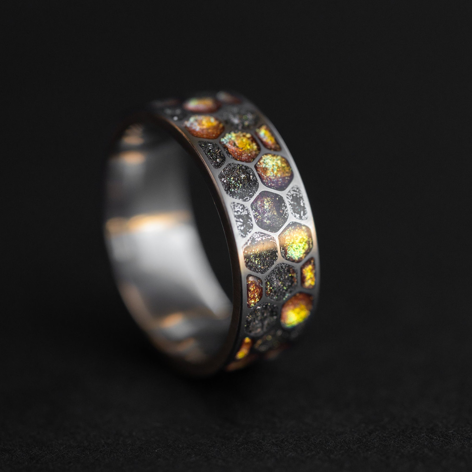Top view of the Golden Honeycomb ring showing the hexagonal cell pattern filled with gold and meteorite.