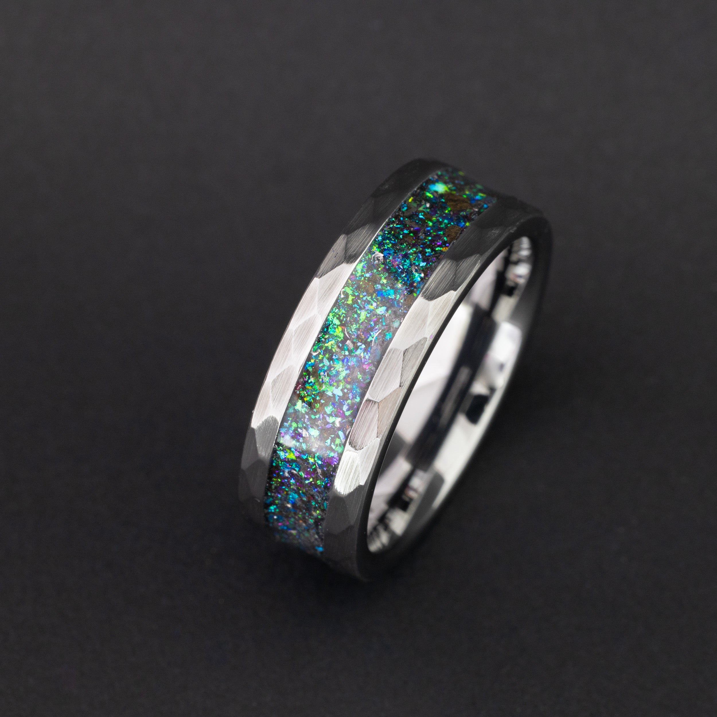 Handcrafted 8mm tungsten wedding band featuring prehistoric shark tooth and vibrant nebula color.