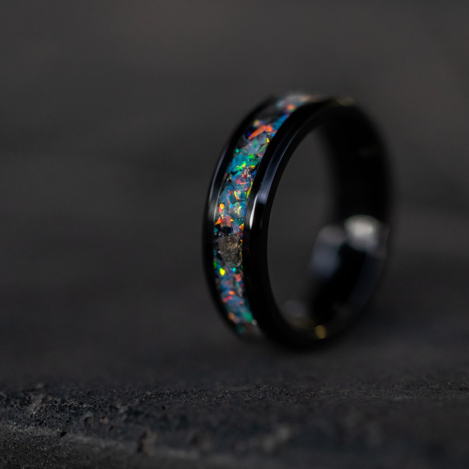 6mm beveled black ceramic ring with authentic lunar meteorite fragments and rainbow moonstone opal inlay
