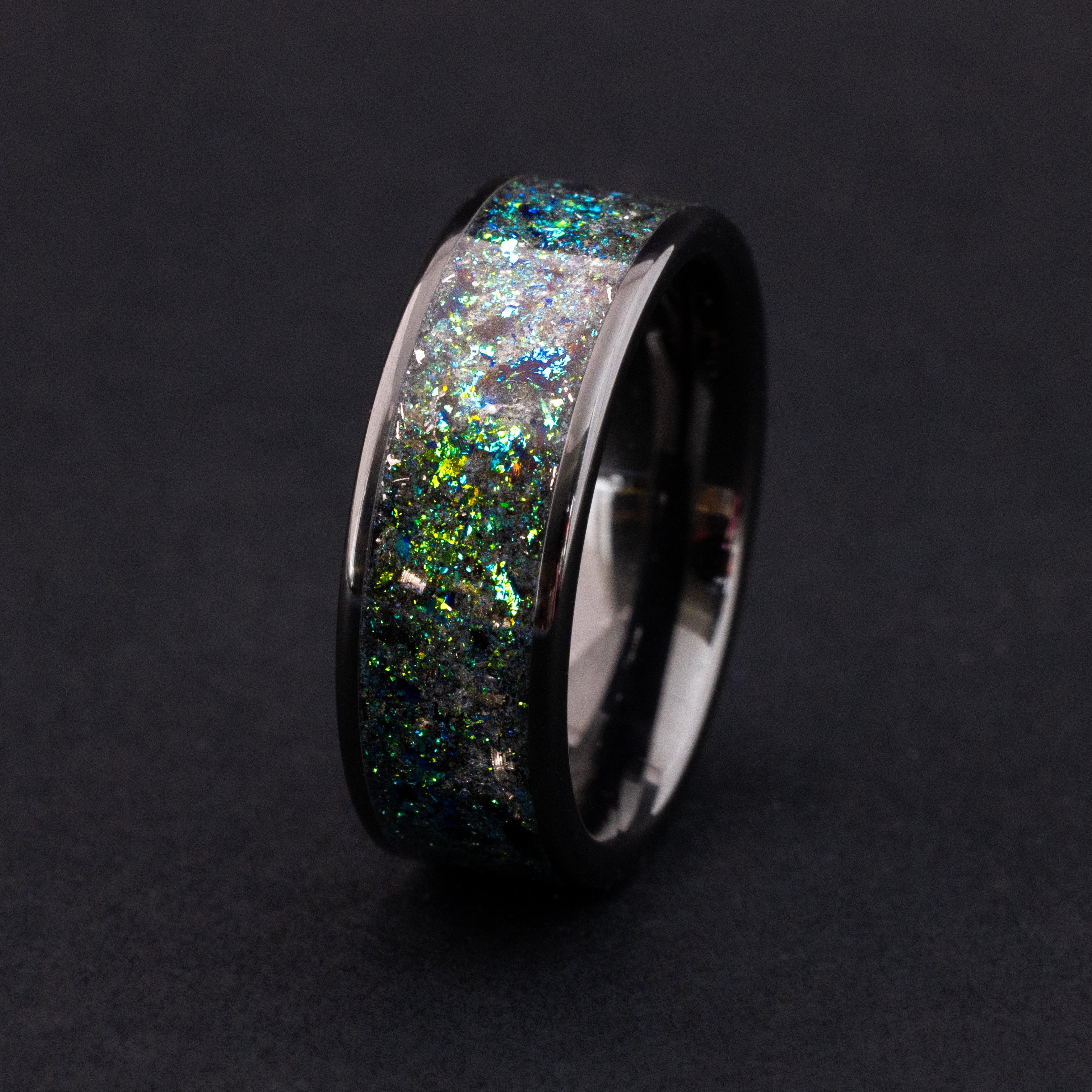 8mm black ceramic ring with Megalodon tooth fossil, Campo meteorite, and teal glow inlay.