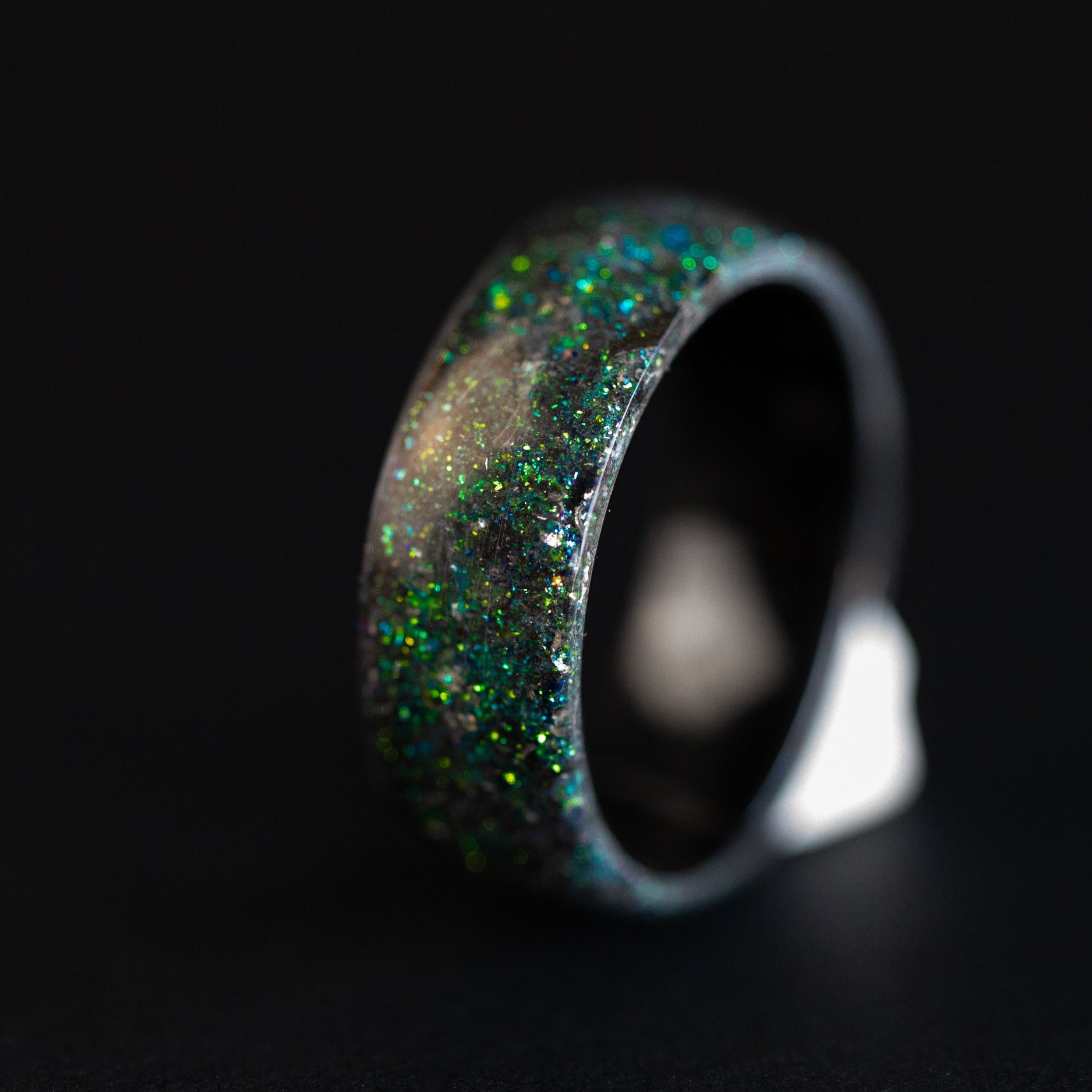 Handcrafted endless black ceramic mens wedding band featuring authentic Megalodon tooth fossil and Campo del Cielo meteorite galaxy