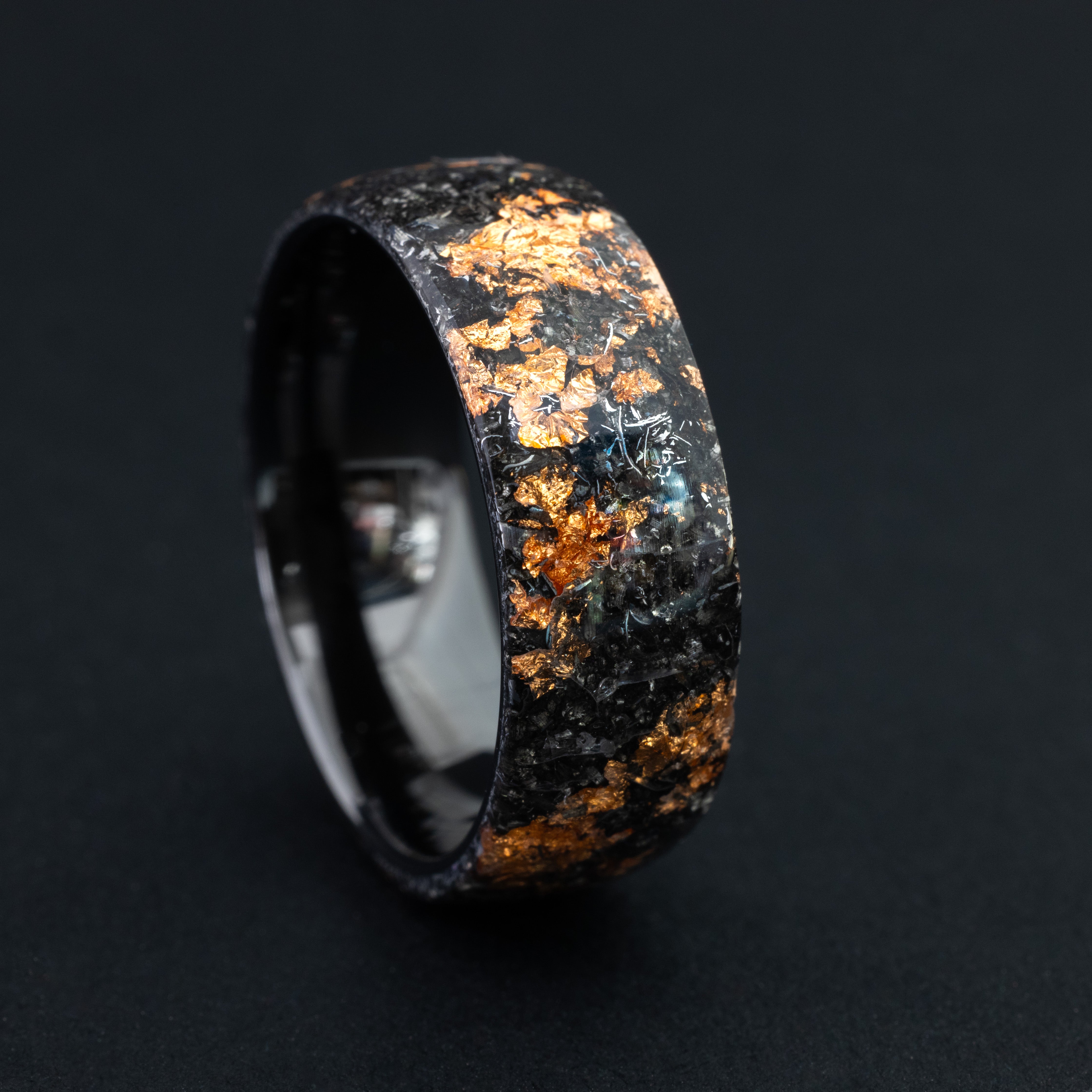 ceramic ring featuring authentic celestial meteorite and bright copper metallic inlay.