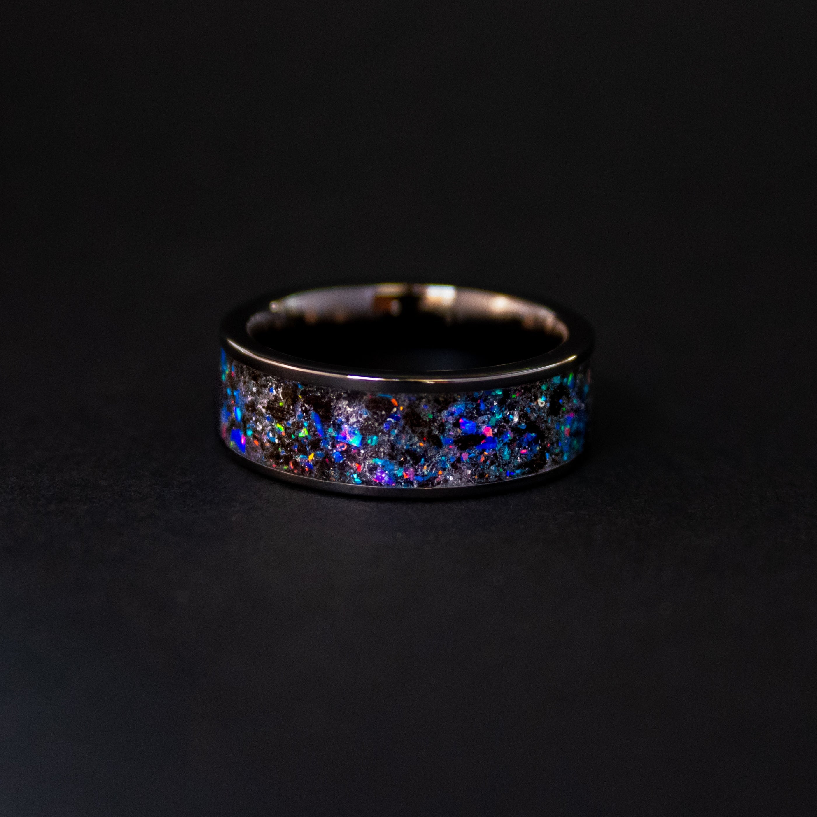 8mm wide channel black ceramic ring with authentic Megalodon tooth and Campo del Cielo meteorite in midnight opal inlay glowing blue in the dark