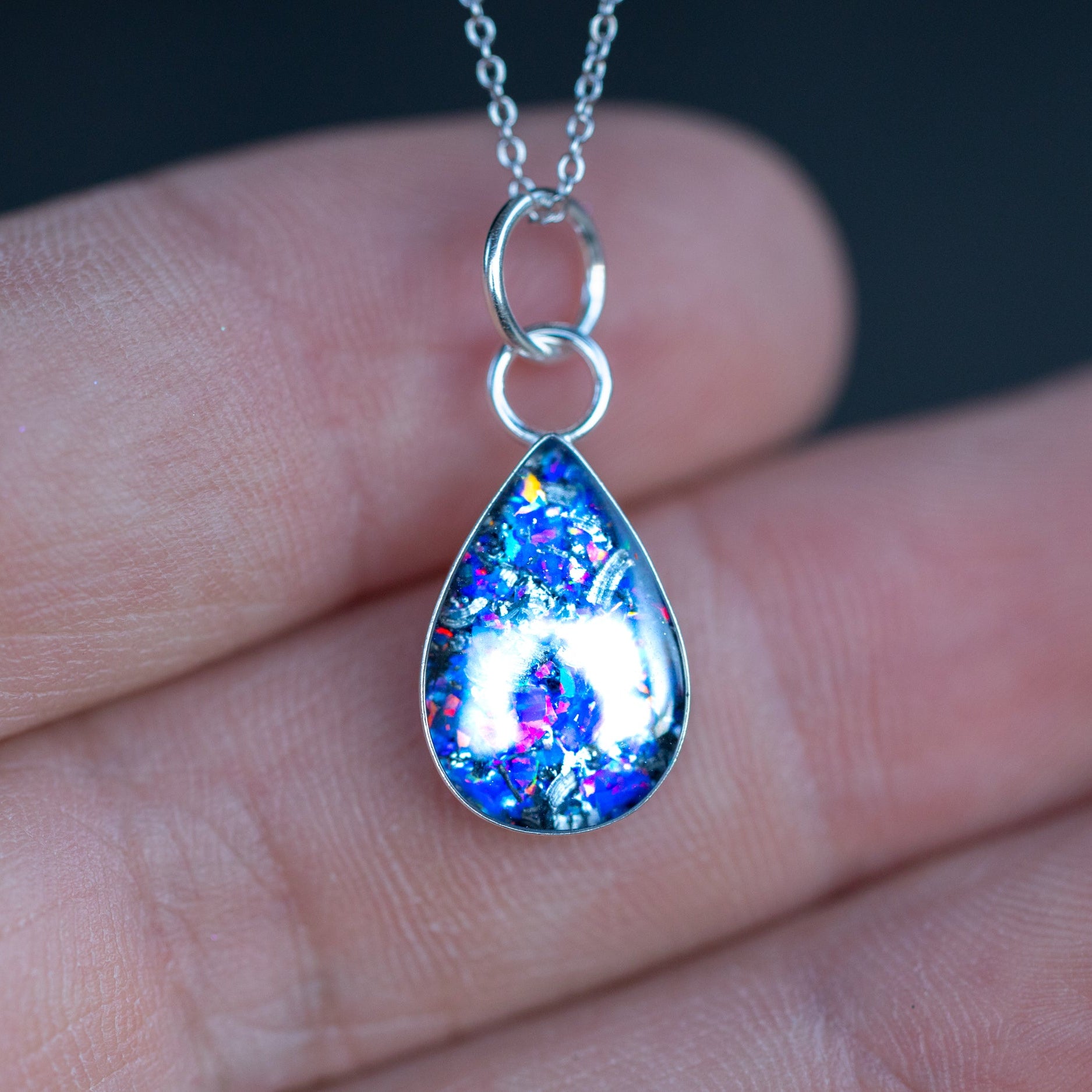 Handcrafted Midnight Opal and meteorite teardrop pendant necklace in sterling silver with Campo Del Cielo meteorite and proprietary purple blue opal inlay