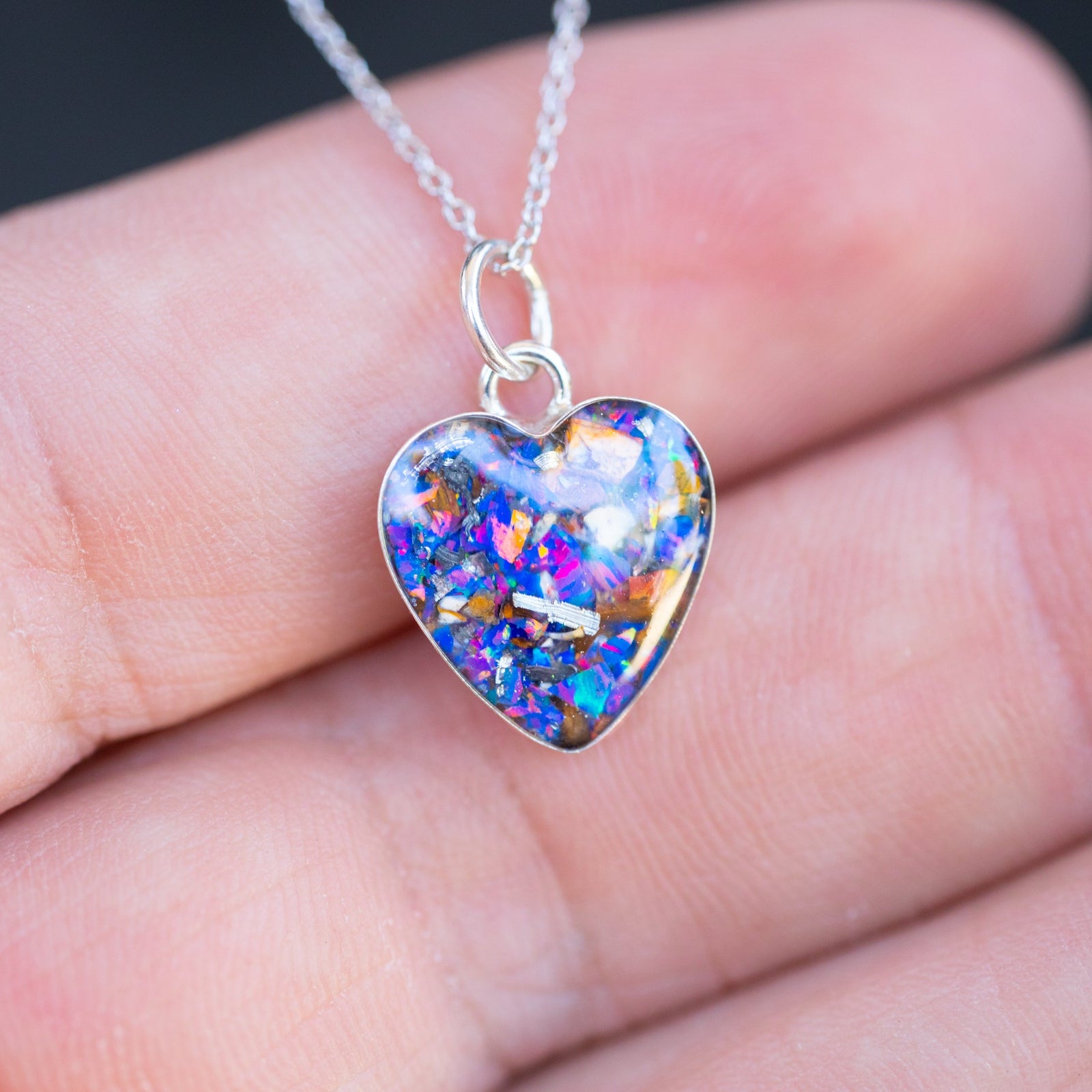 Midnight Raptor Heart authentic silver heart pendant necklace with Campo Del Cielo meteorite, real velociraptor fossil bone, and Midnight Opal inlay