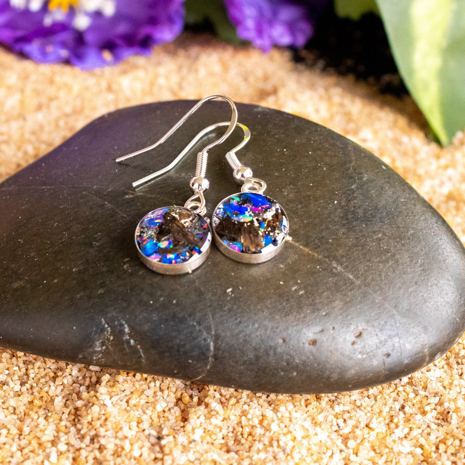 Handcrafted tyrannosaurus rex fossil silver dangle earrings with Campo Del Cielo meteorite, real dinosaur bone, and Midnight Opal inlay