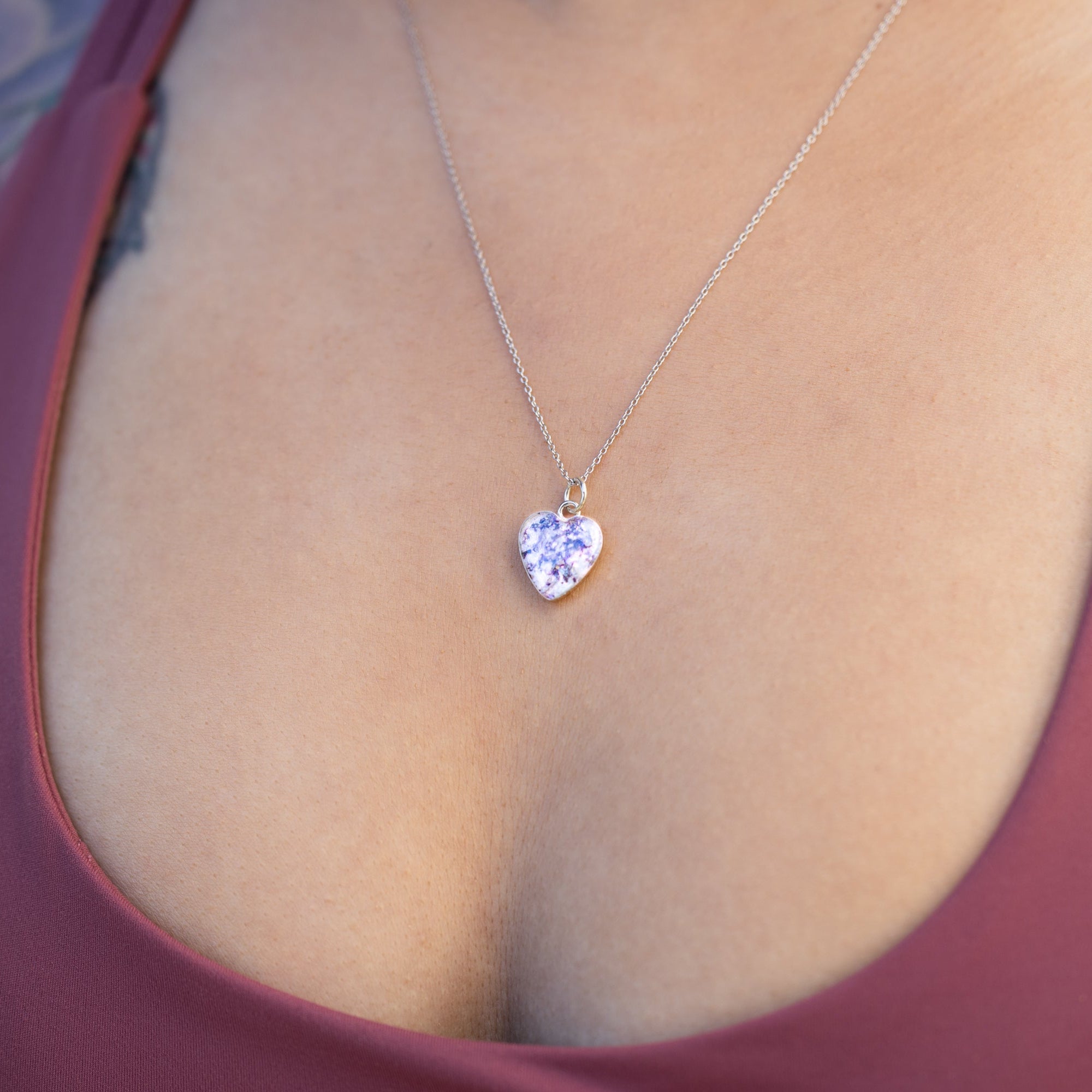 Handcrafted pearl-toned heart pendant necklace in sterling silver with Campo Del Cielo meteorite and iridescent pink and white resin inlay