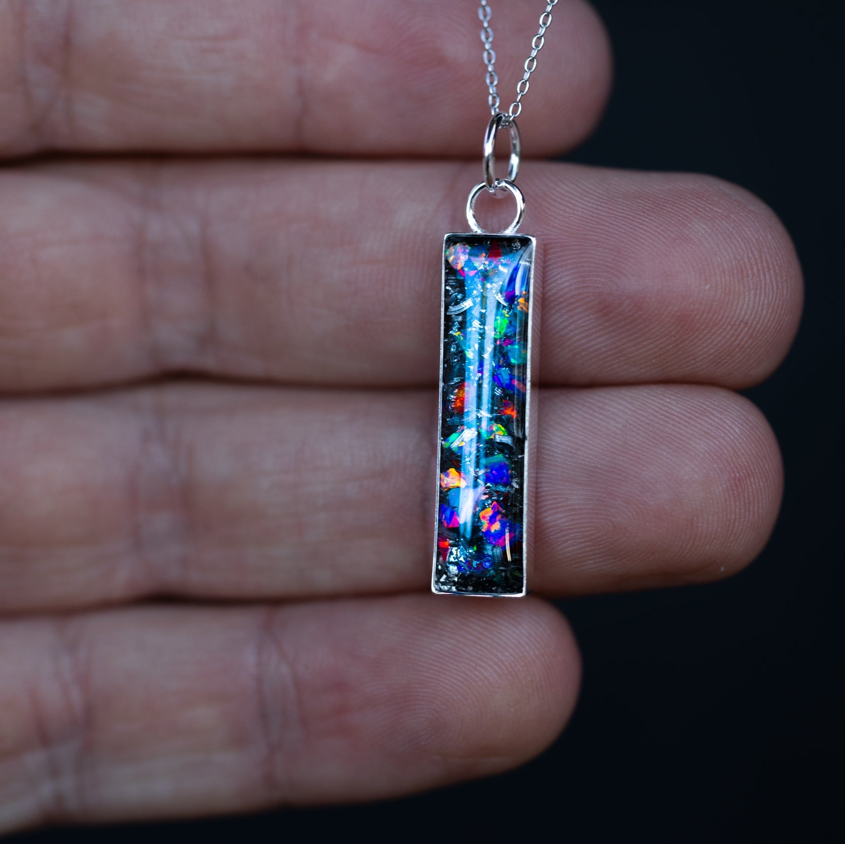 Handcrafted multi color opal meteorite bar pendant necklace in sterling silver with Campo Del Cielo meteorite and red, blue, purple, green, white, and orange opals