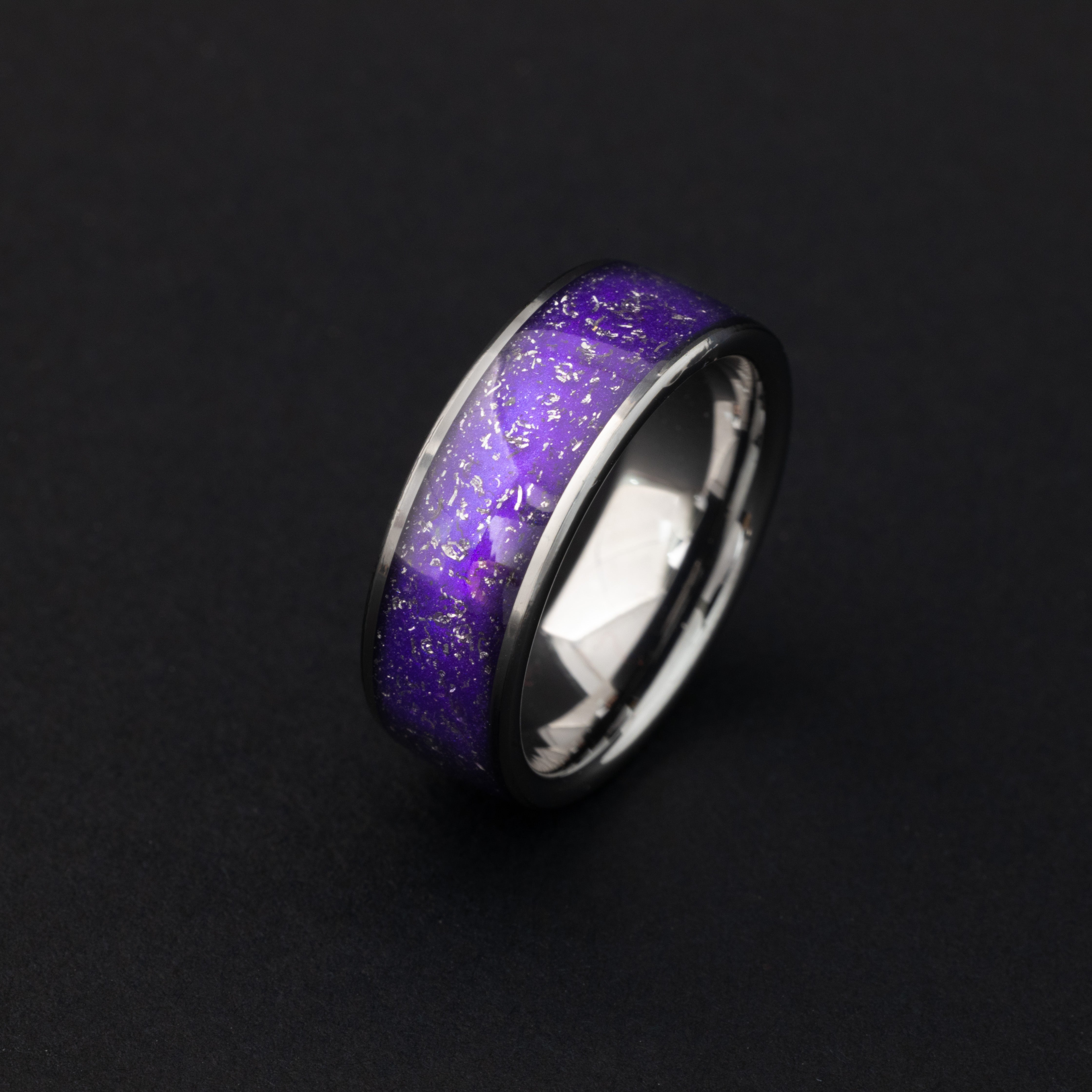 Close up of meteorite shavings in a vibrant purple 8mm tungsten ring.