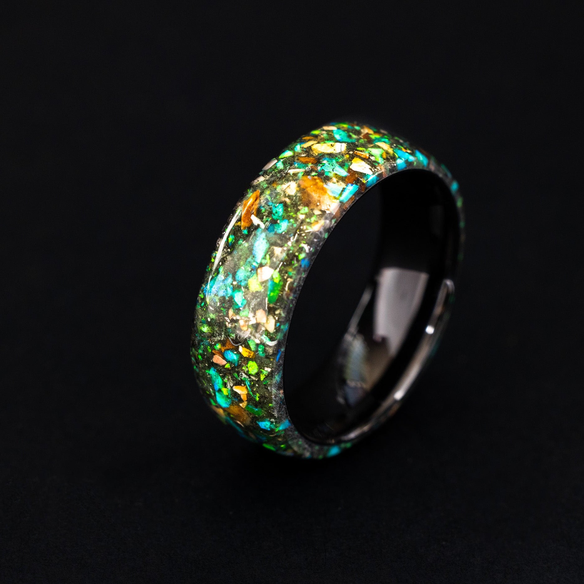 Endless black ceramic ring with authentic Velociraptor bone, meteorite, and neon green glow inlay