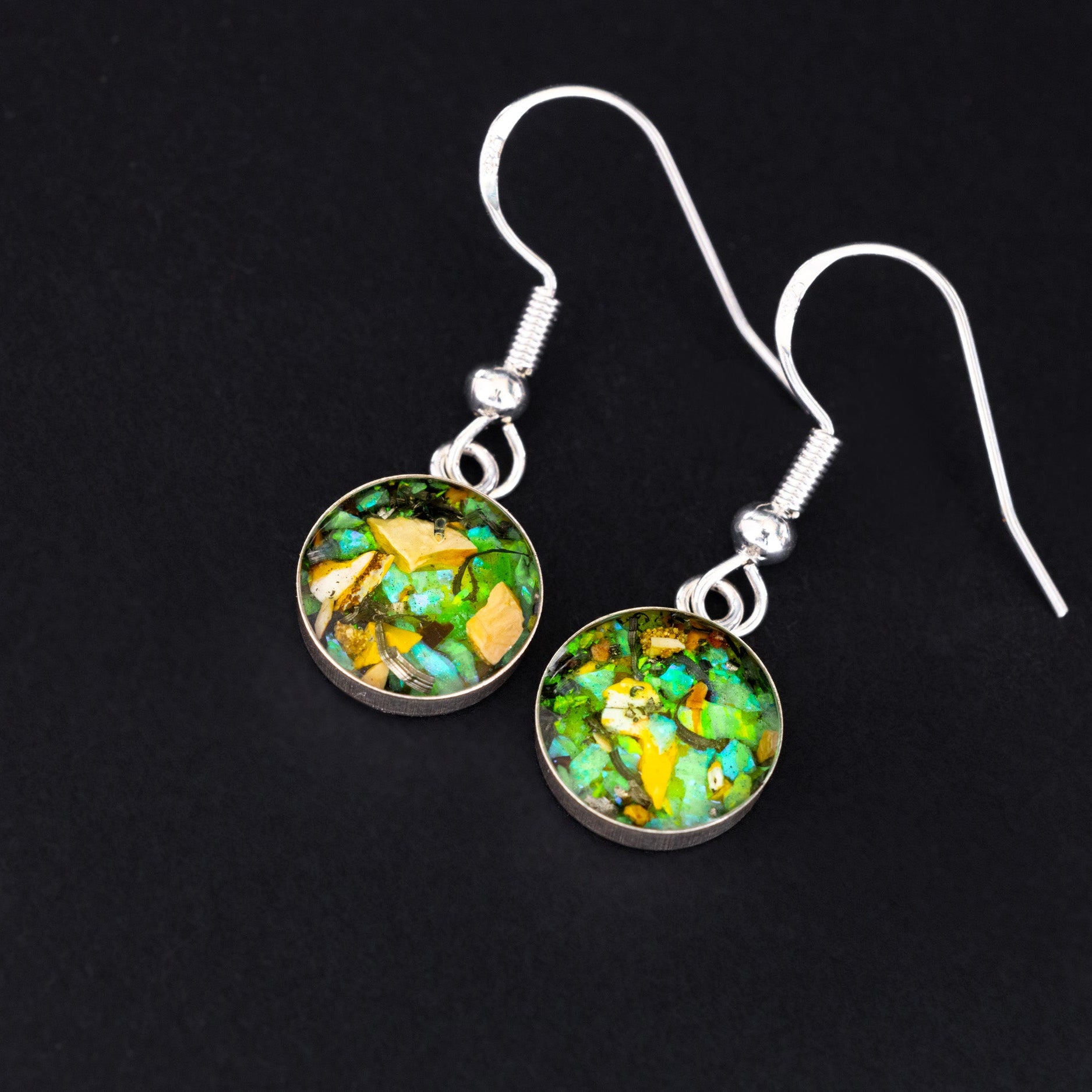 Radioactive Velociraptor authentic silver dangle earrings with Campo Del Cielo meteorite, real velociraptor fossil bone, green opal, and green glow in the dark pigment