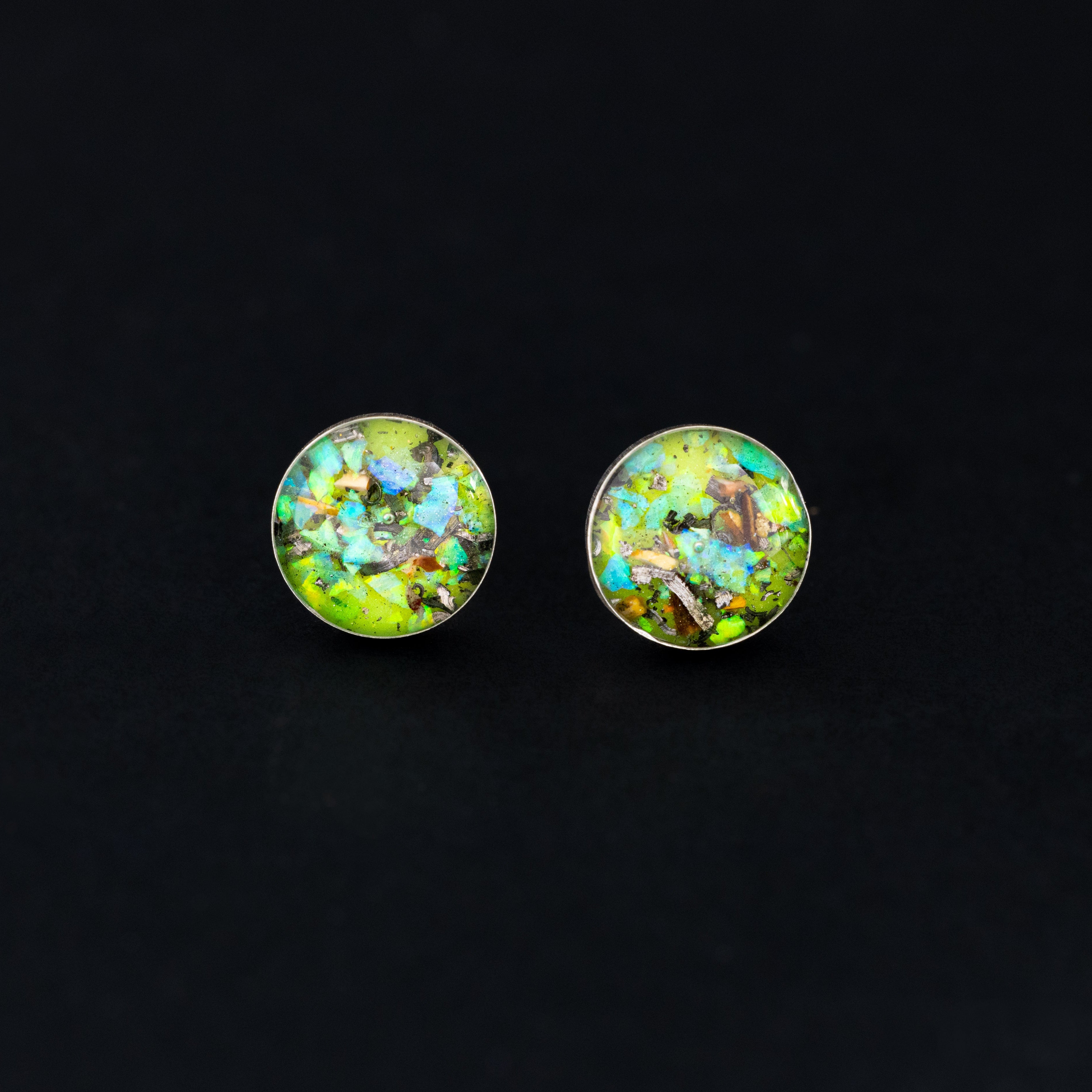 Radioactive Velociraptor Studs authentic silver stud earrings with Campo Del Cielo meteorite, real velociraptor fossil bone, green opal, and green glow in the dark pigment