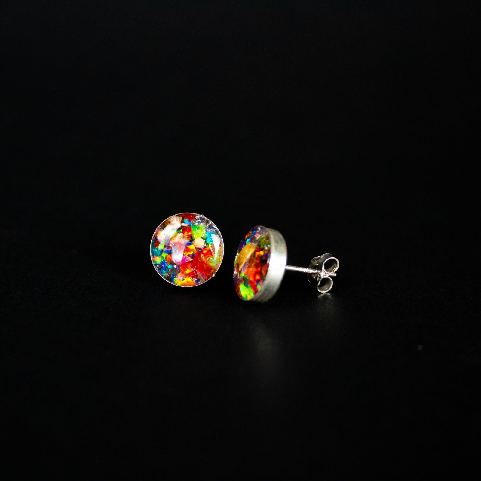 Rainbow Dinosaur Studs authentic silver stud earrings with Campo Del Cielo meteorite, real dinosaur bone, and rainbow opal inlay in red, orange, blue, purple, green, and white