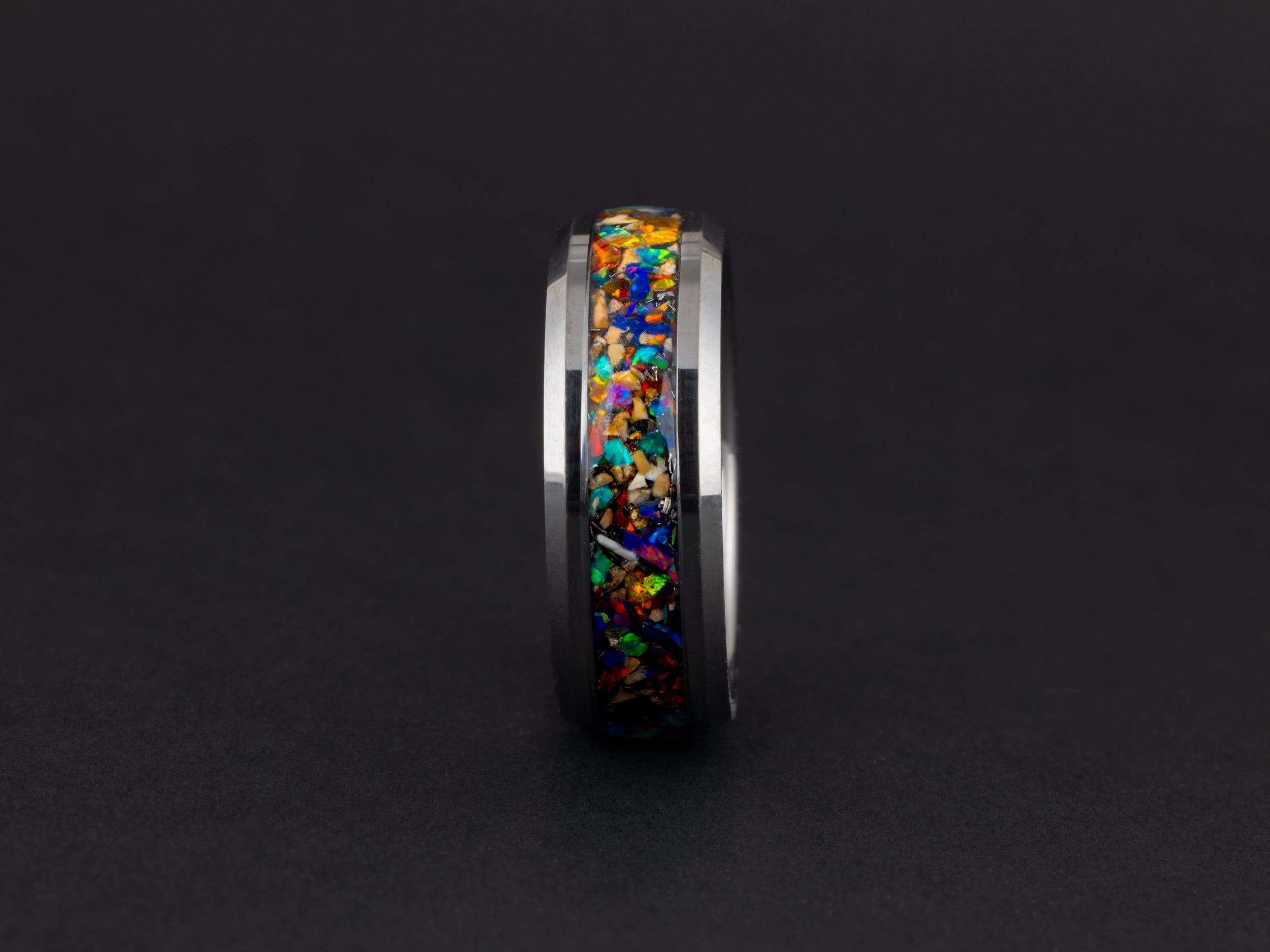 Unique 8mm beveled tungsten ring featuring authentic meteorite and vibrant rainbow opals.