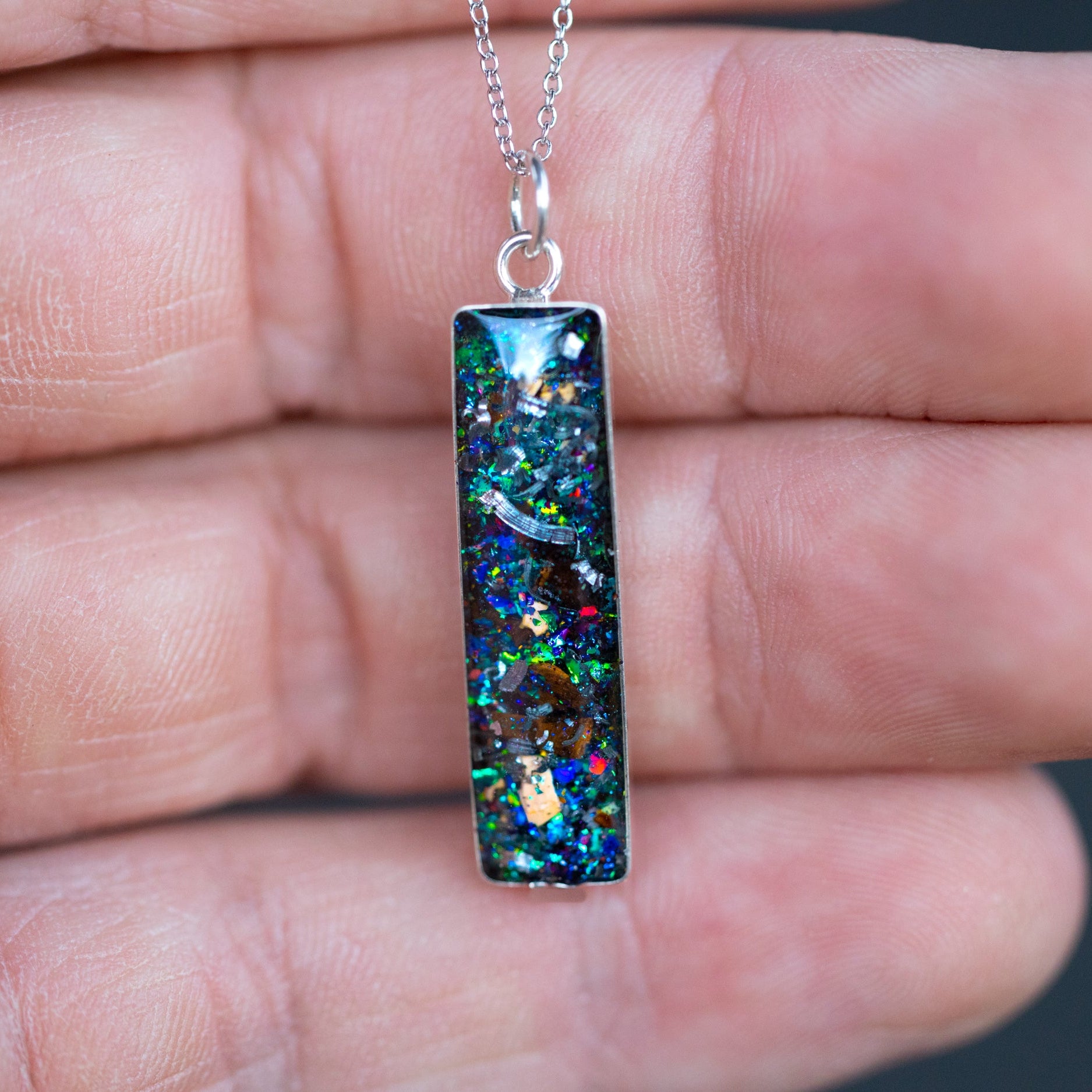 Shop the Raptor and Rex Comet authentic silver meteorite and real dinosaur bone bar pendant necklace. Handcrafted T-Rex velociraptor fossil necklace from California.