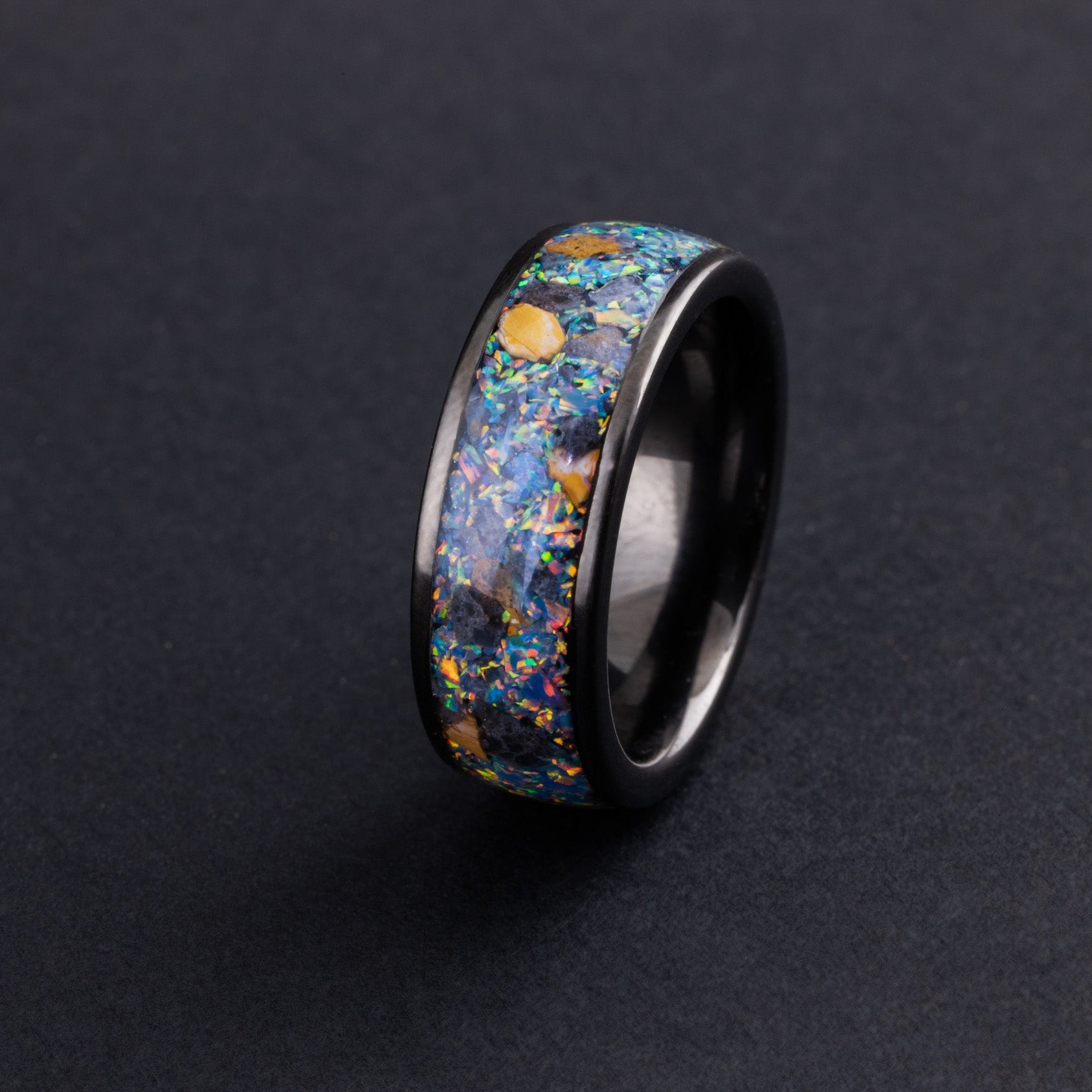 Rare lunar meteorite and Velociraptor bone ring in a black ceramic band