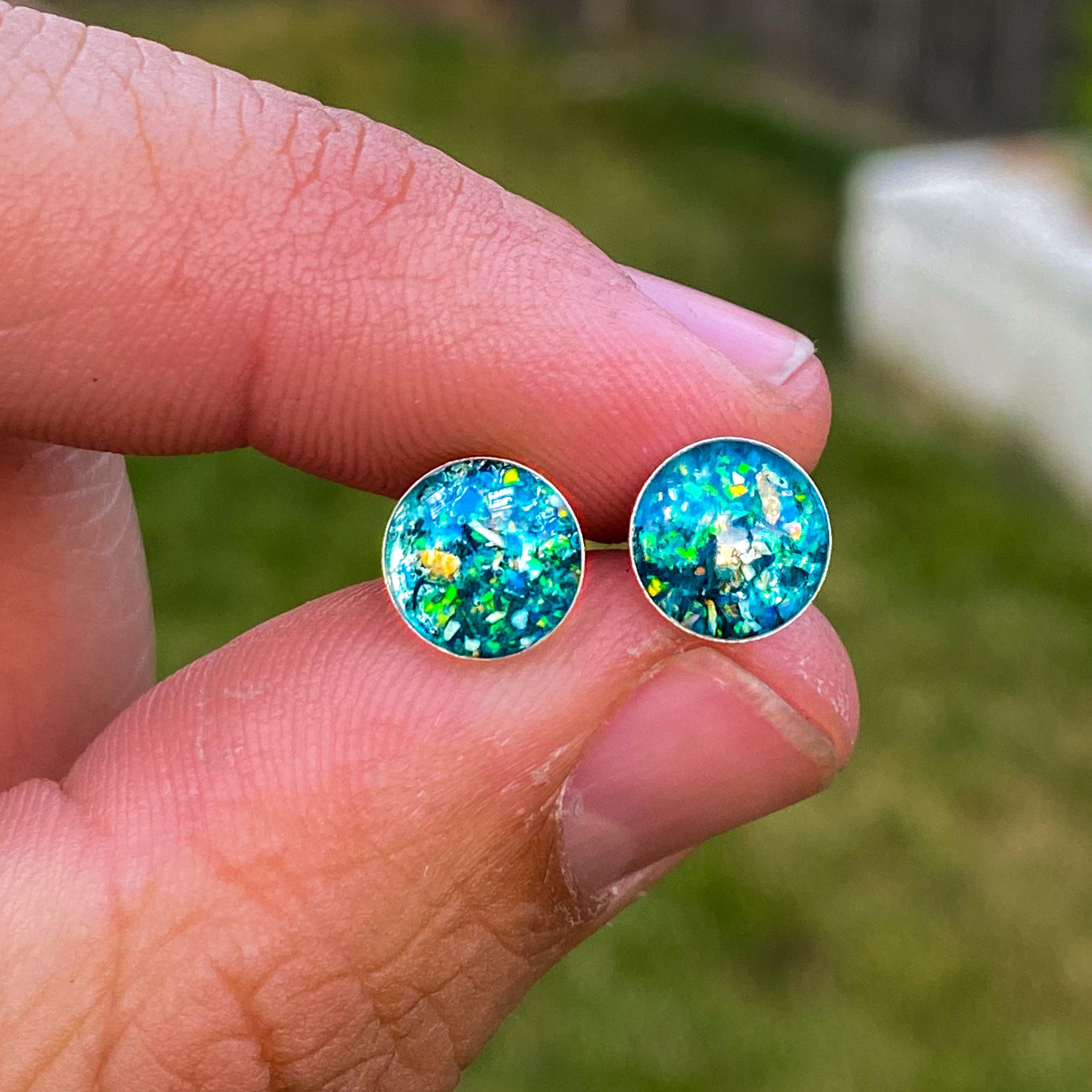 Handcrafted dinosaur fossil silver stud earrings with Campo Del Cielo meteorite, real dinosaur bone, and teal opal inlay