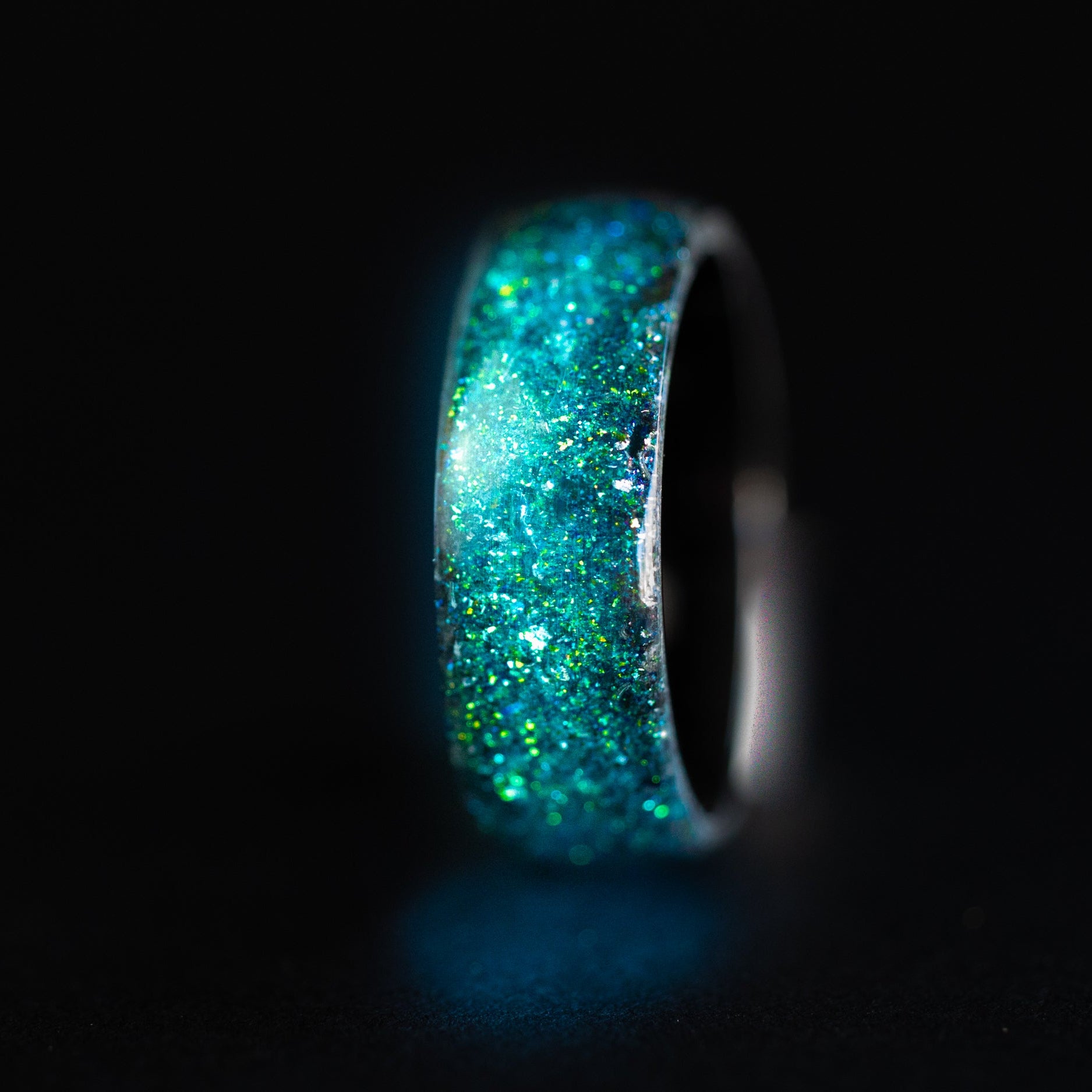 Endless black ceramic ring with authentic Megalodon tooth fossil and Campo del Cielo meteorite in blue and green galaxy opal inlay