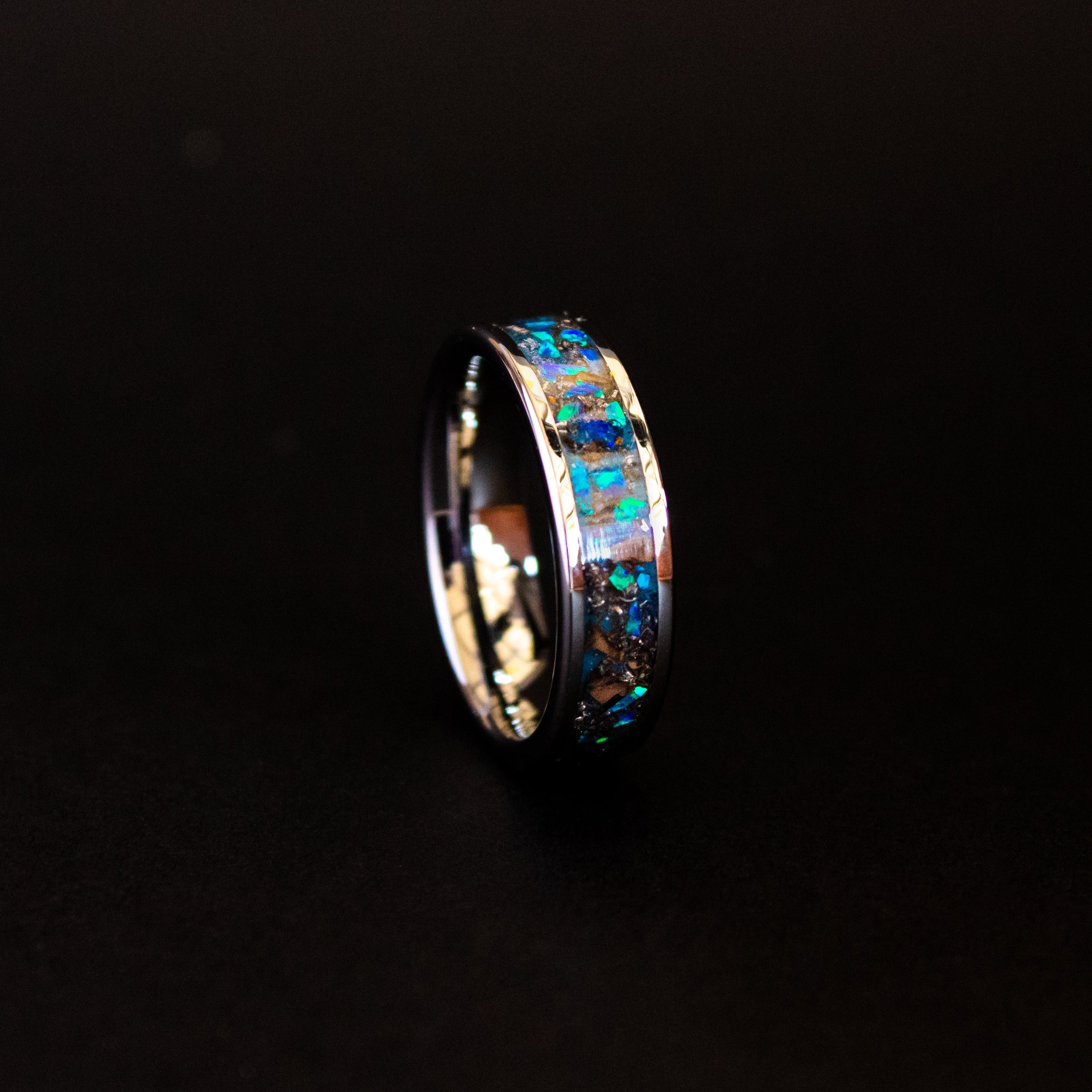 6mm beveled tungsten ring with authentic Triceratops bone and Campo del Cielo meteorite in blue opal inlay glowing blue in the dark