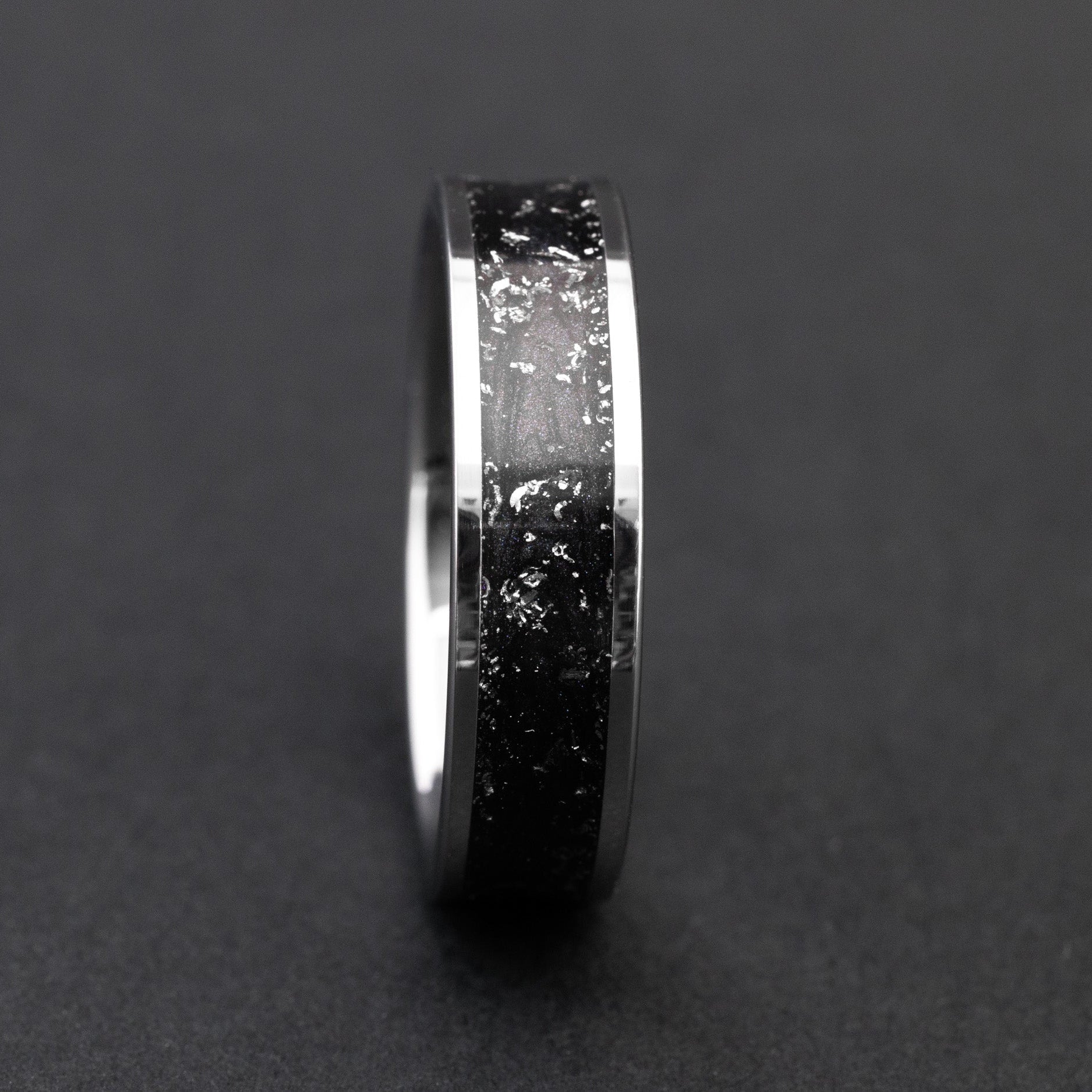 Handcrafted 6mm tungsten wedding band featuring celestial Gibeon fragments and midnight black inlay.