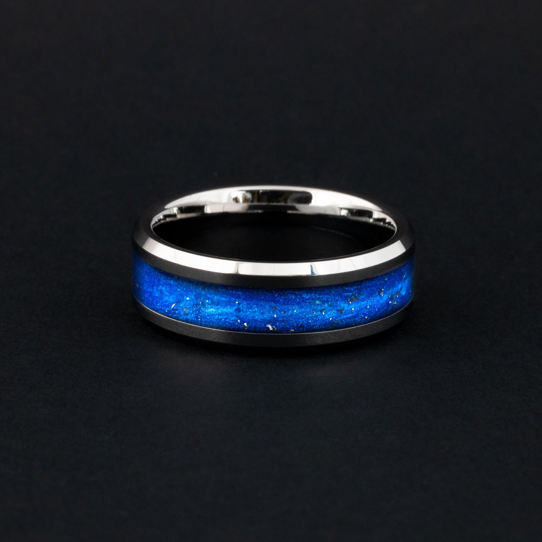 Handcrafted 8mm tungsten wedding band featuring celestial meteorite fragments and blue inlay.