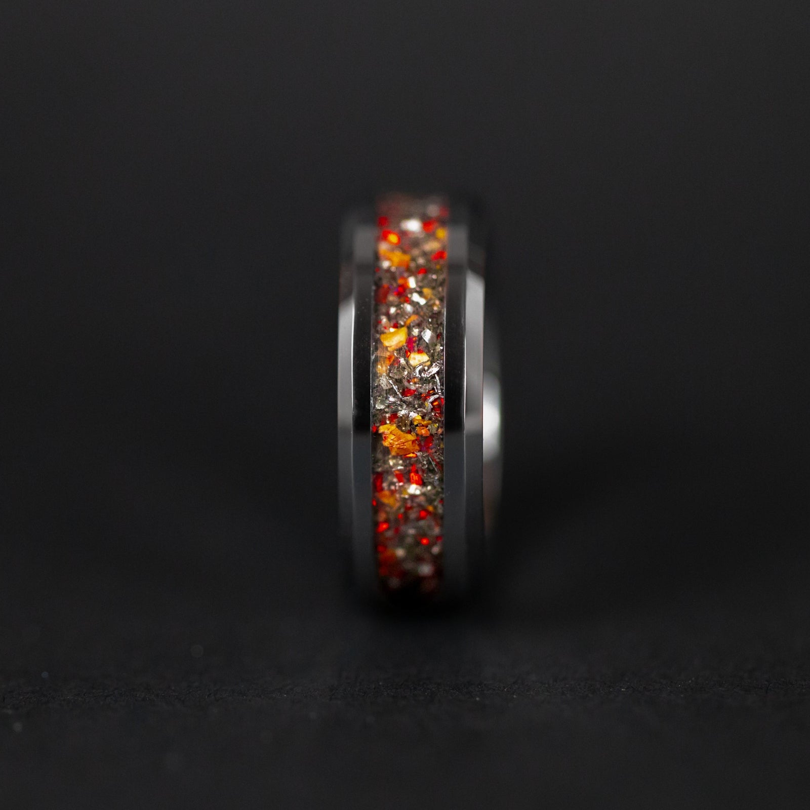 Handcrafted 8mm beveled tungsten mens wedding band with authentic Velociraptor bone and Campo del Cielo meteorite with red opal accents made in California