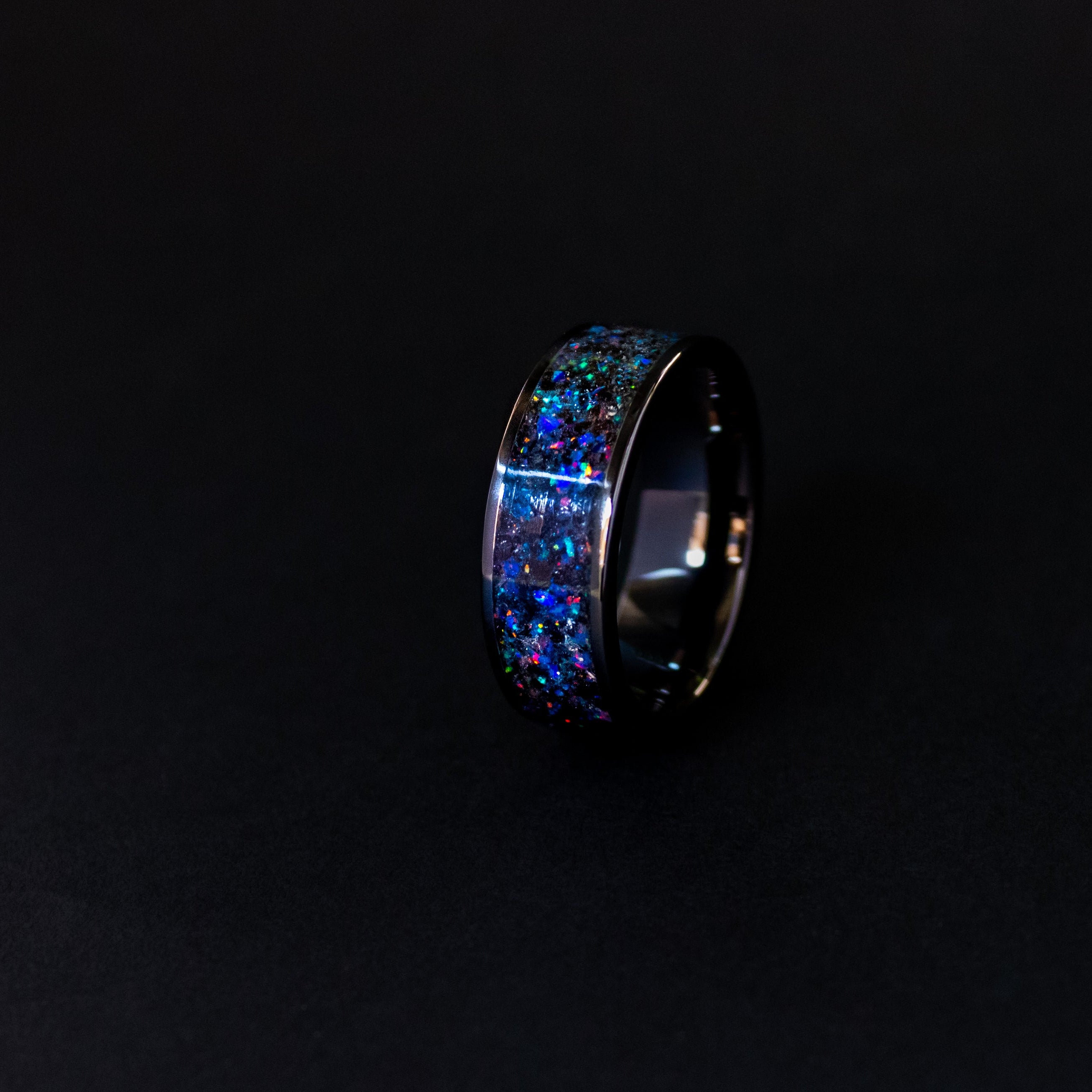Handcrafted 8mm wide channel black ceramic mens wedding band with authentic Megalodon tooth and Campo del Cielo meteorite in midnight opal blue glow inlay made in California
