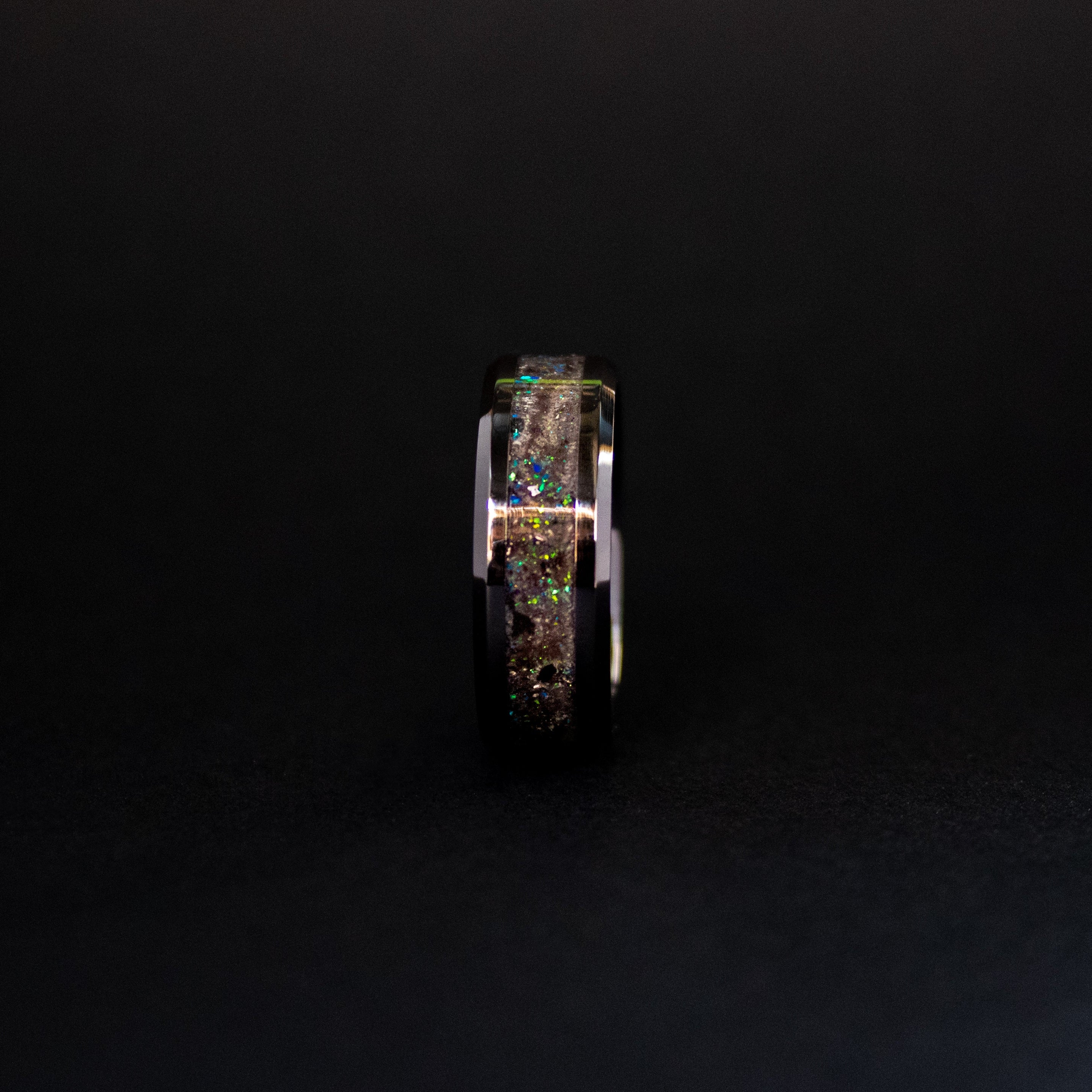 Handcrafted 8mm beveled black ceramic mens wedding band with authentic Megalodon tooth and Campo del Cielo meteorite in blue green opal teal glow inlay made in California