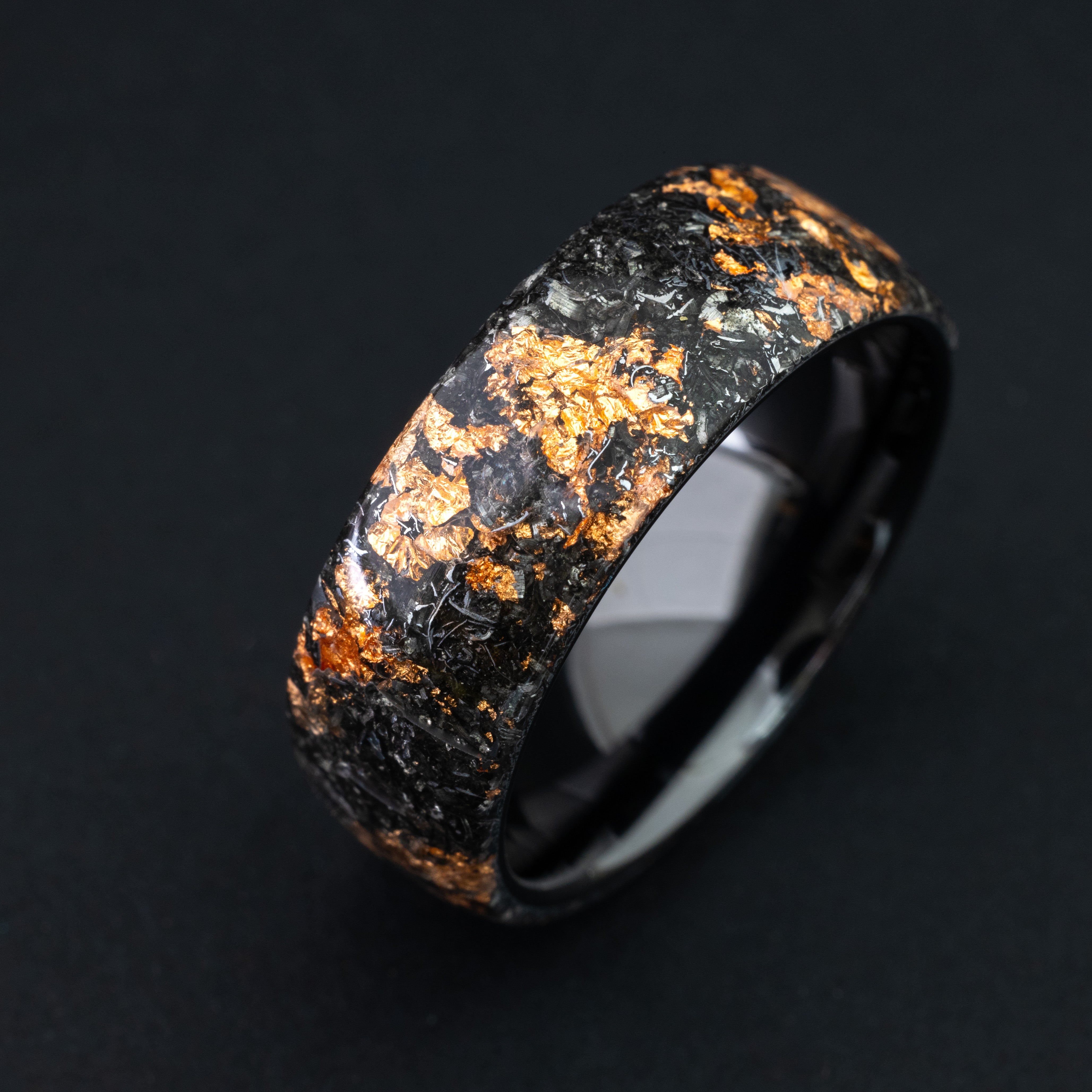 Endless ceramic ring featuring authentic celestial meteorite and bright copper metallic inlay.