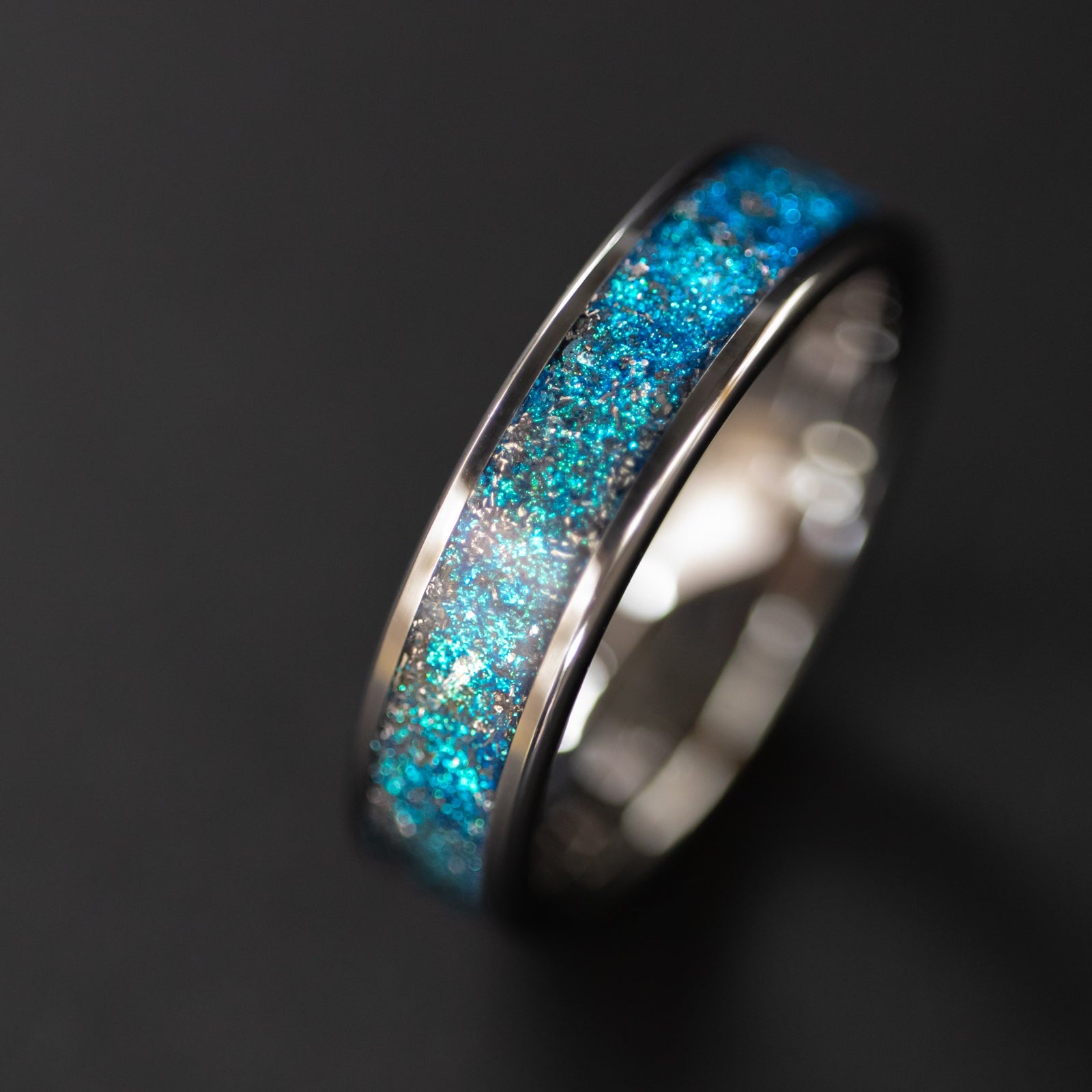 Handcrafted 6mm wide channel tungsten mens wedding band with authentic Campo del Cielo meteorite in blue glitter pigment inlay made in California
