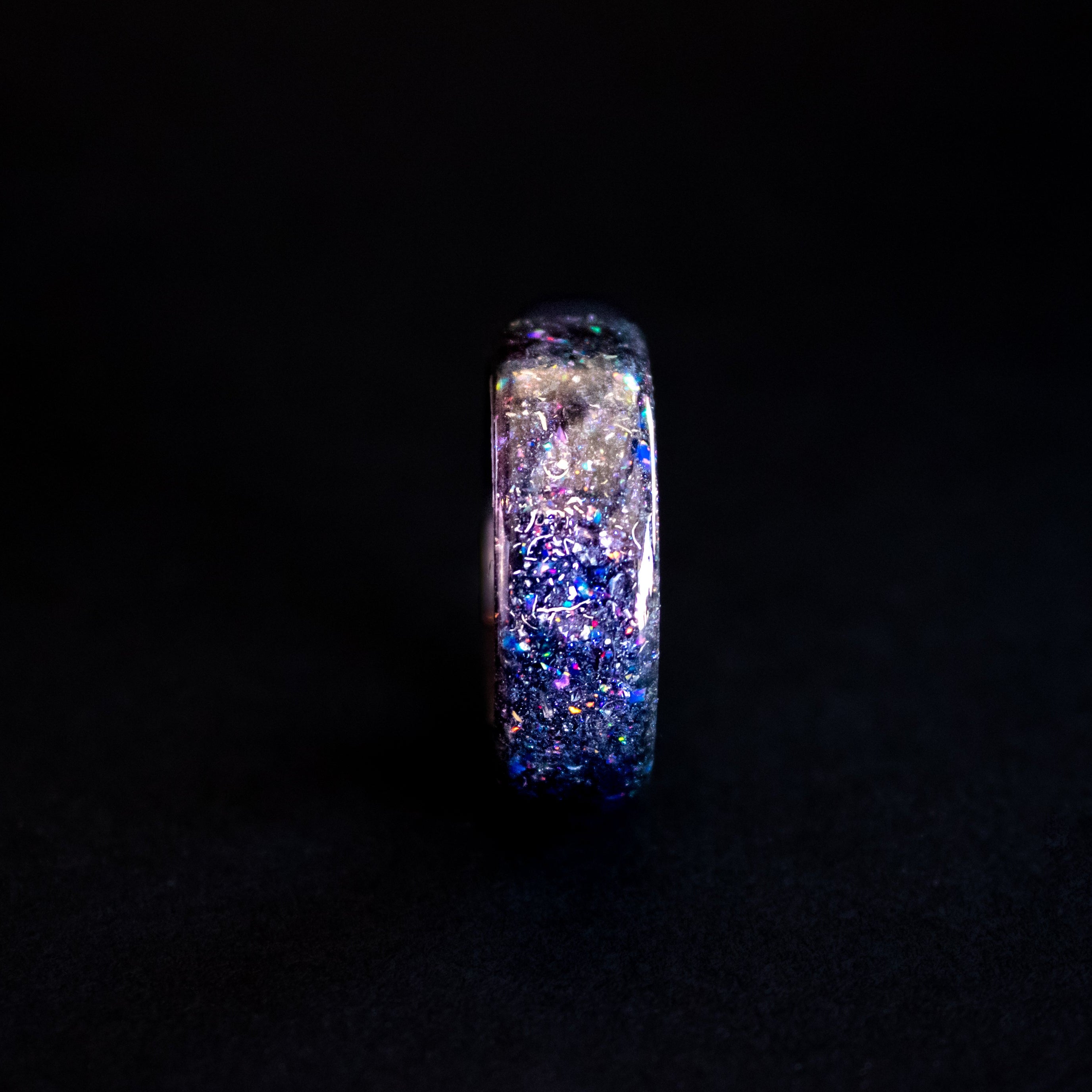 Handcrafted endless black ceramic mens wedding band with authentic Campo del Cielo meteorite in blue and purple opal galaxy pigment inlay made in California