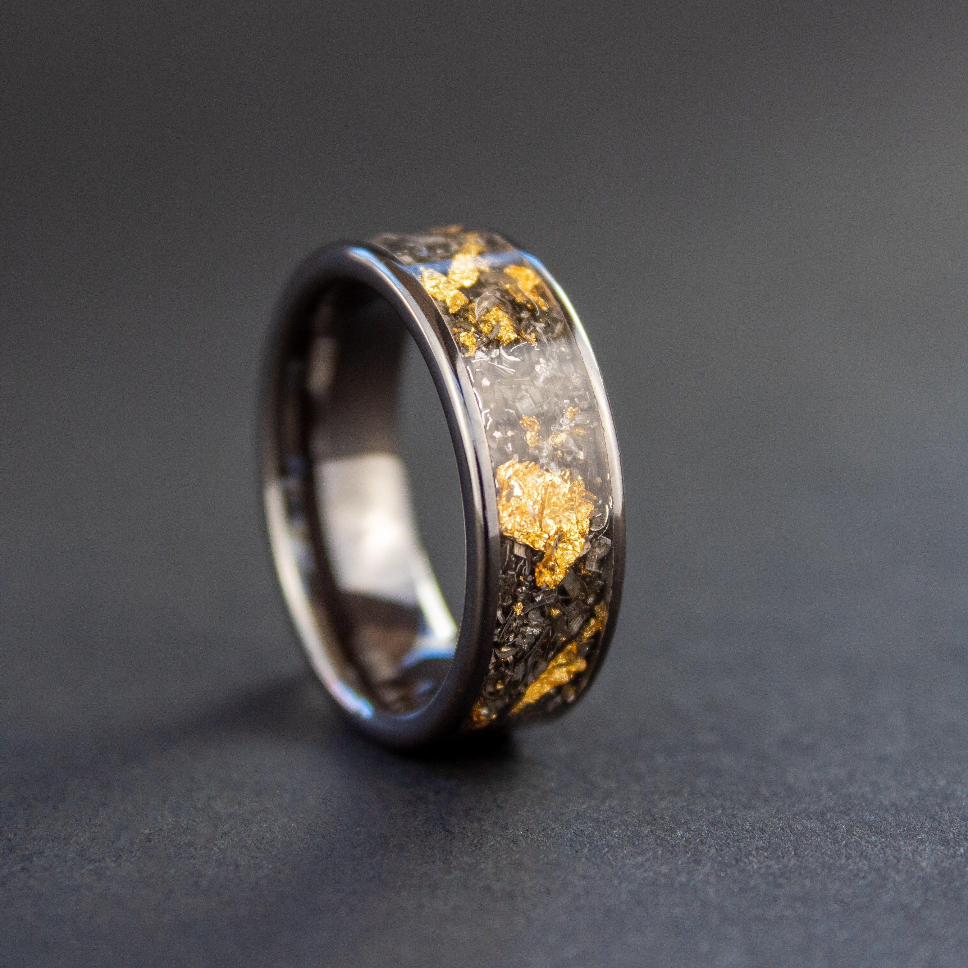 Handcrafted 8mm wide channel black ceramic mens wedding band with authentic Campo del Cielo meteorite and real gold metal flake inlay made in California
