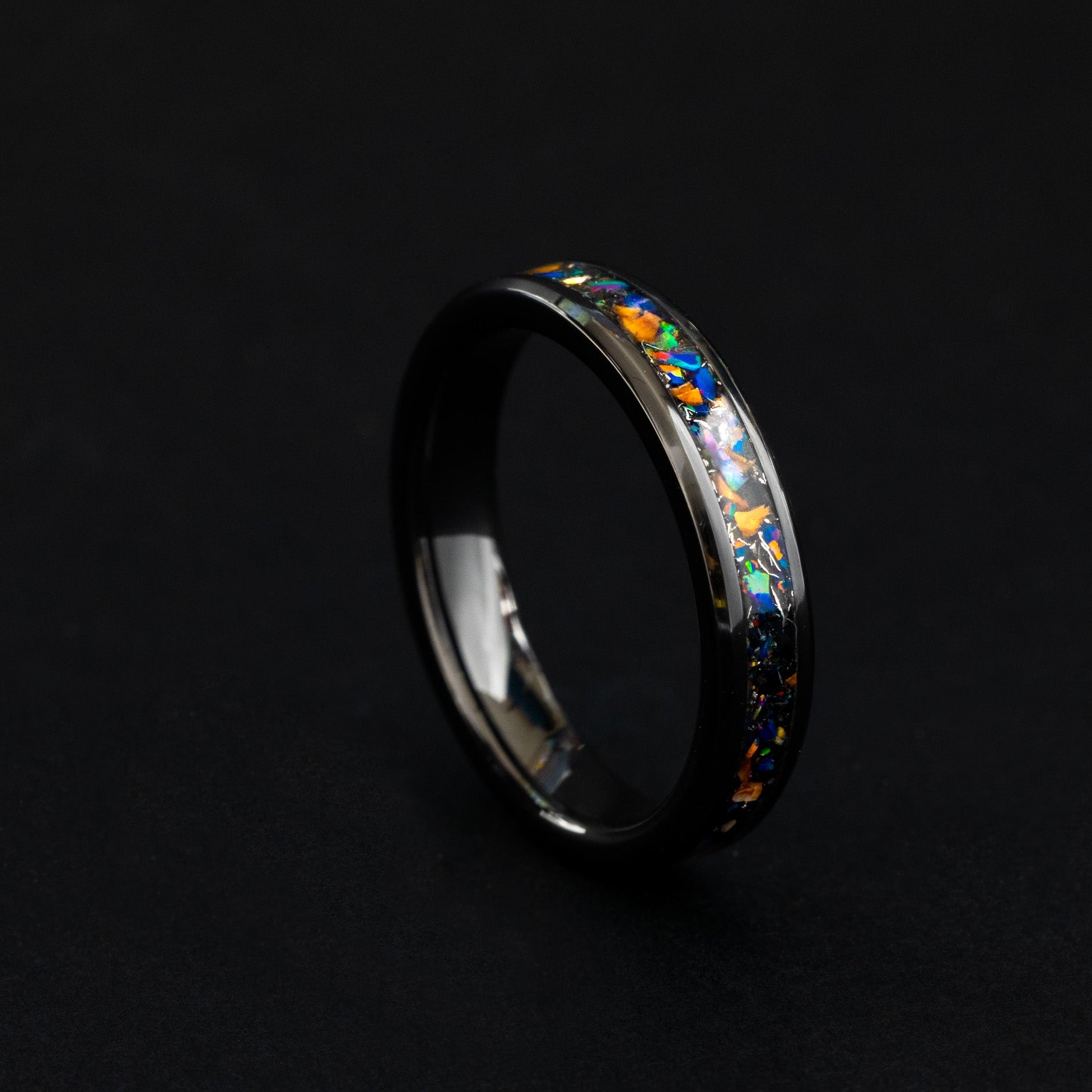 Handcrafted 4mm ceramic wedding band featuring prehistoric raptor bone and purple opal.