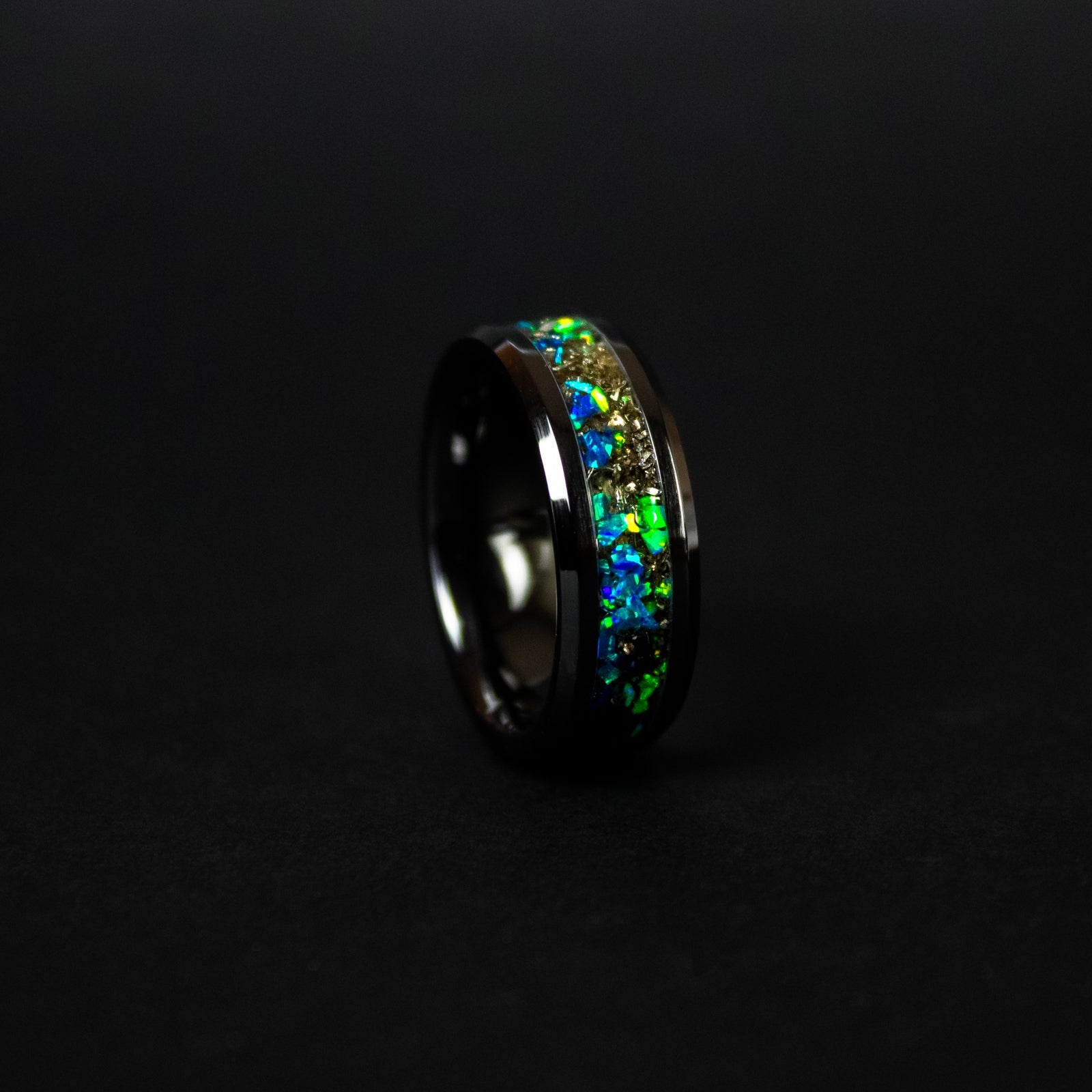 Handcrafted 8mm beveled black ceramic mens wedding band with authentic Campo del Cielo meteorite in split blue and green opal inlay made in California