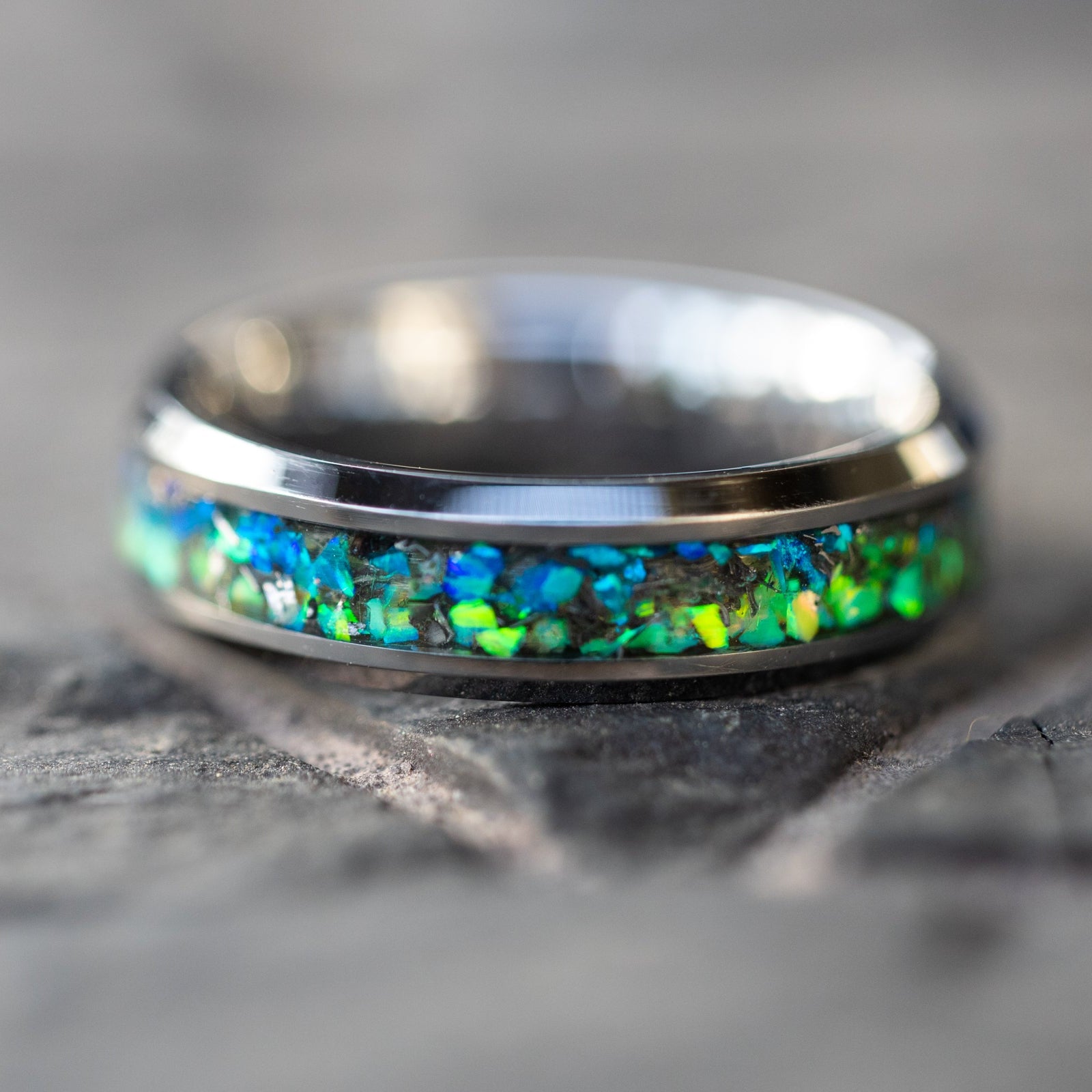 Handcrafted 6mm beveled tungsten mens wedding band with authentic Campo del Cielo meteorite in split blue and green opal inlay made in California