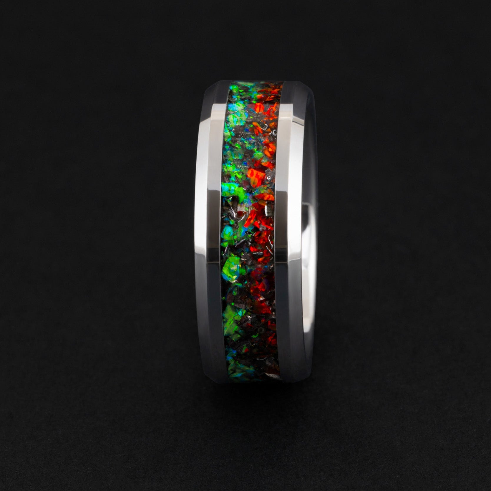 Handcrafted 8mm beveled tungsten mens wedding band with authentic Campo del Cielo meteorite in split red and green opal inlay made in California