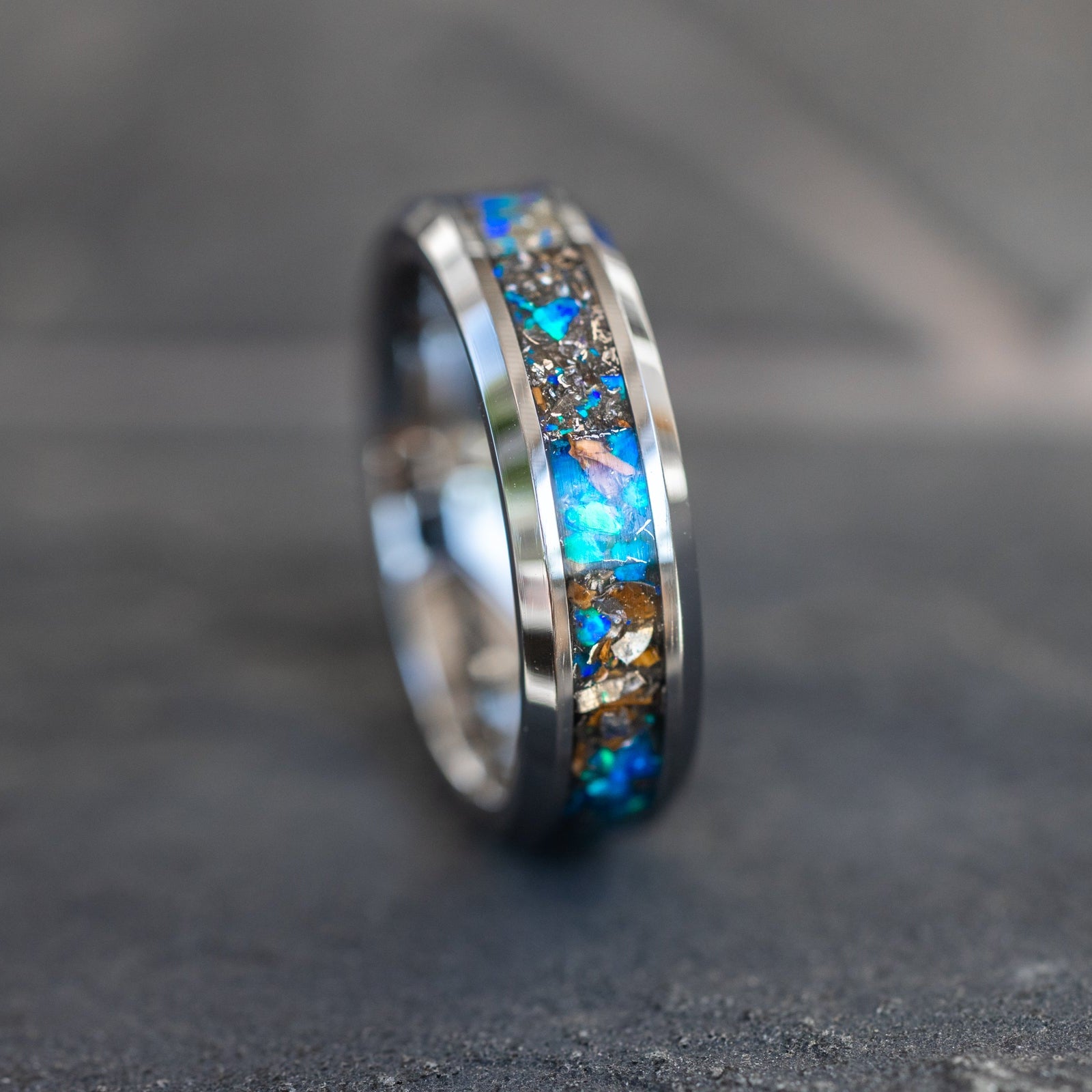 Handcrafted 6mm beveled tungsten mens wedding band with authentic T-Rex bone and Campo del Cielo meteorite in blue opal inlay made in California