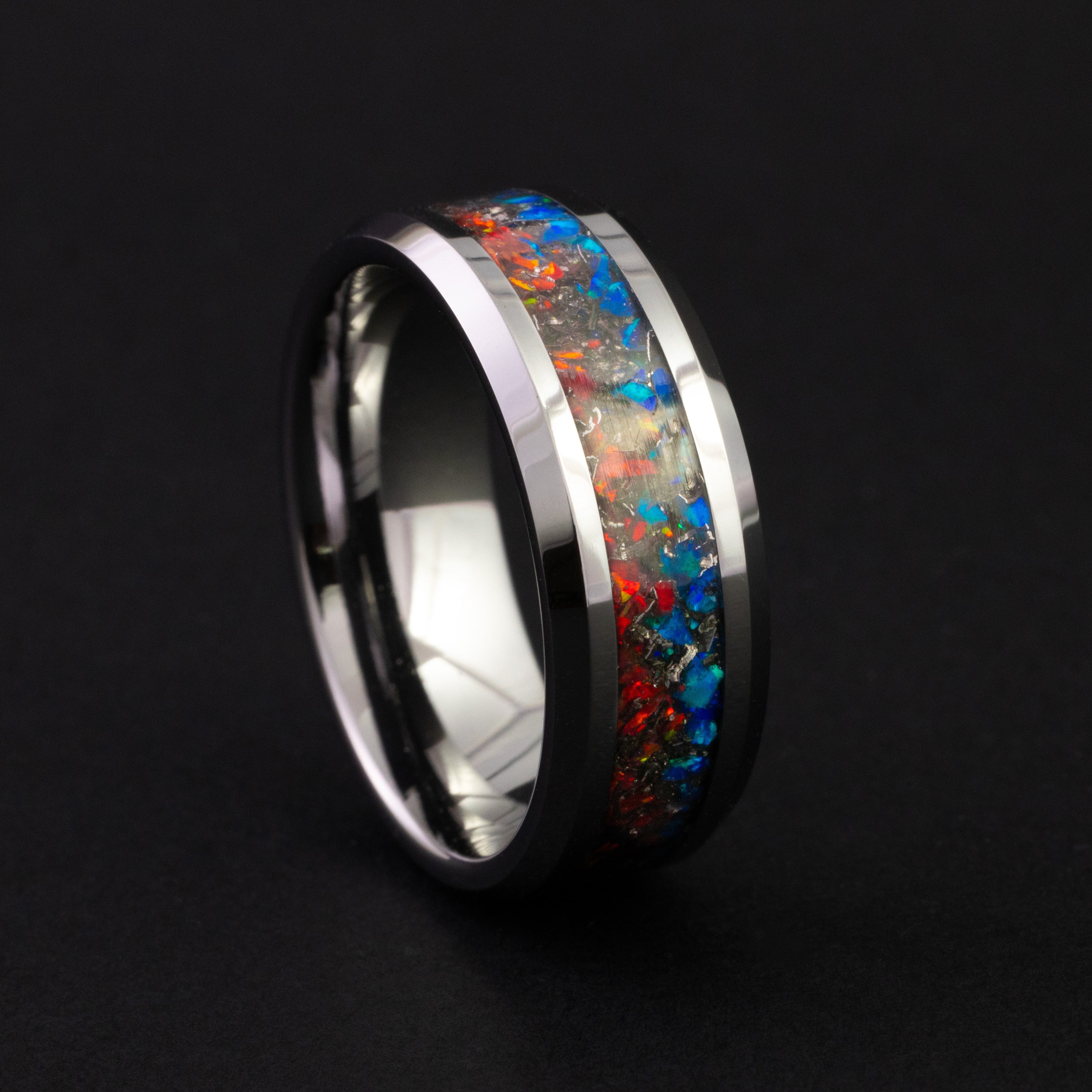 Handcrafted 8mm tungsten wedding band featuring celestial meteorite and vibrant opal inlay.