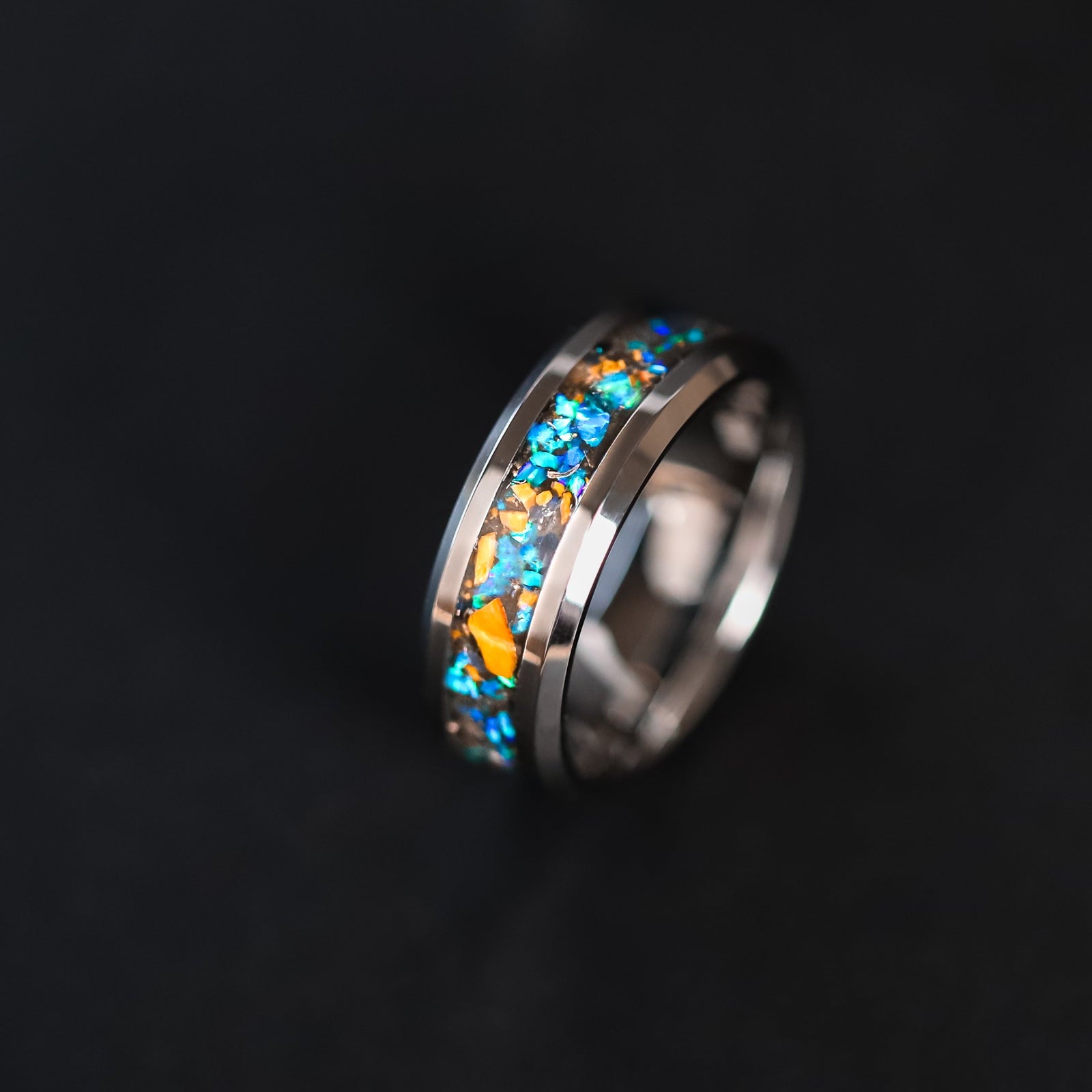 Handcrafted 8mm beveled tungsten mens wedding band with authentic Velociraptor bone and Campo del Cielo meteorite in blue opal inlay made in California