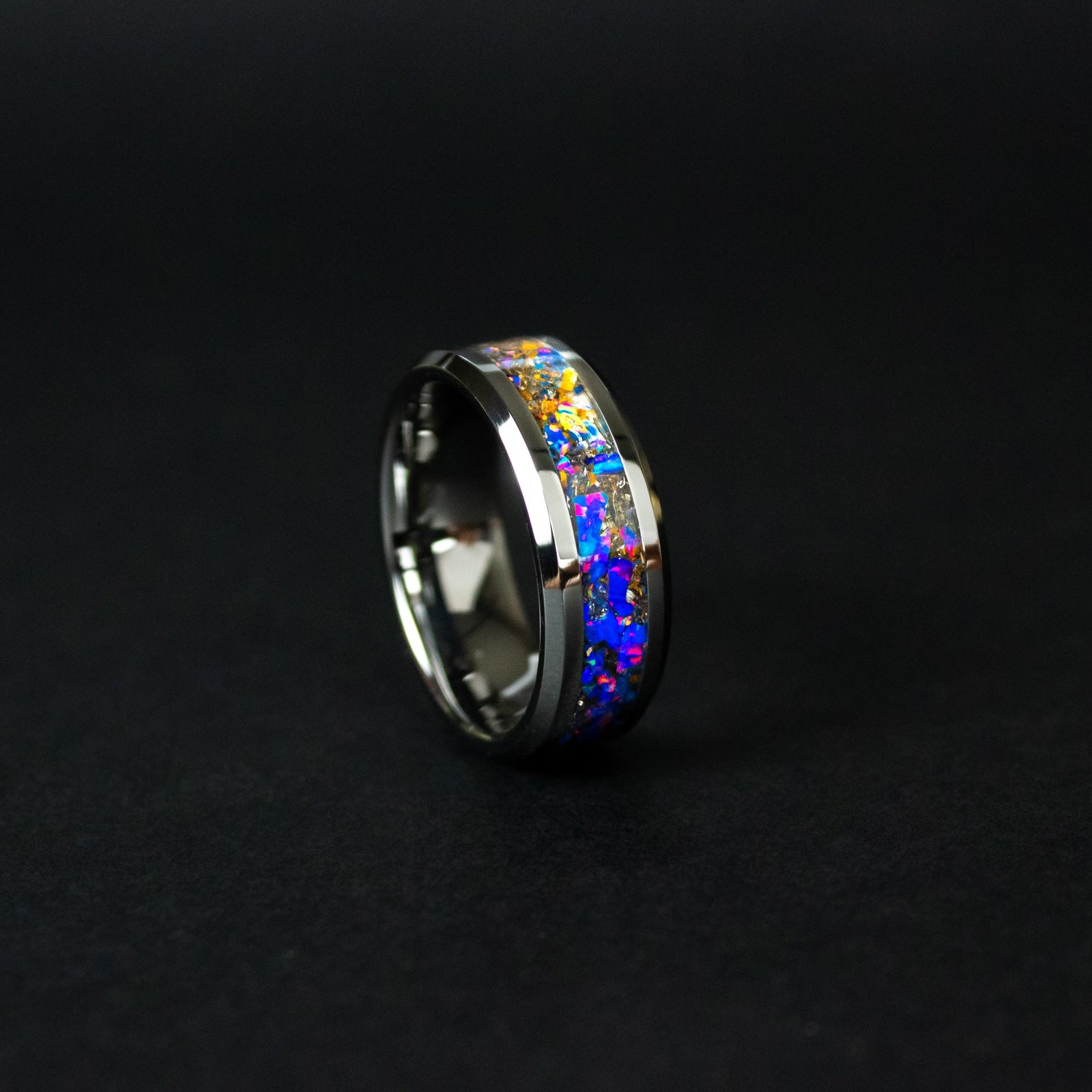 Handcrafted 8mm beveled tungsten mens wedding band with authentic Velociraptor bone and Campo del Cielo meteorite in midnight opal inlay made in California