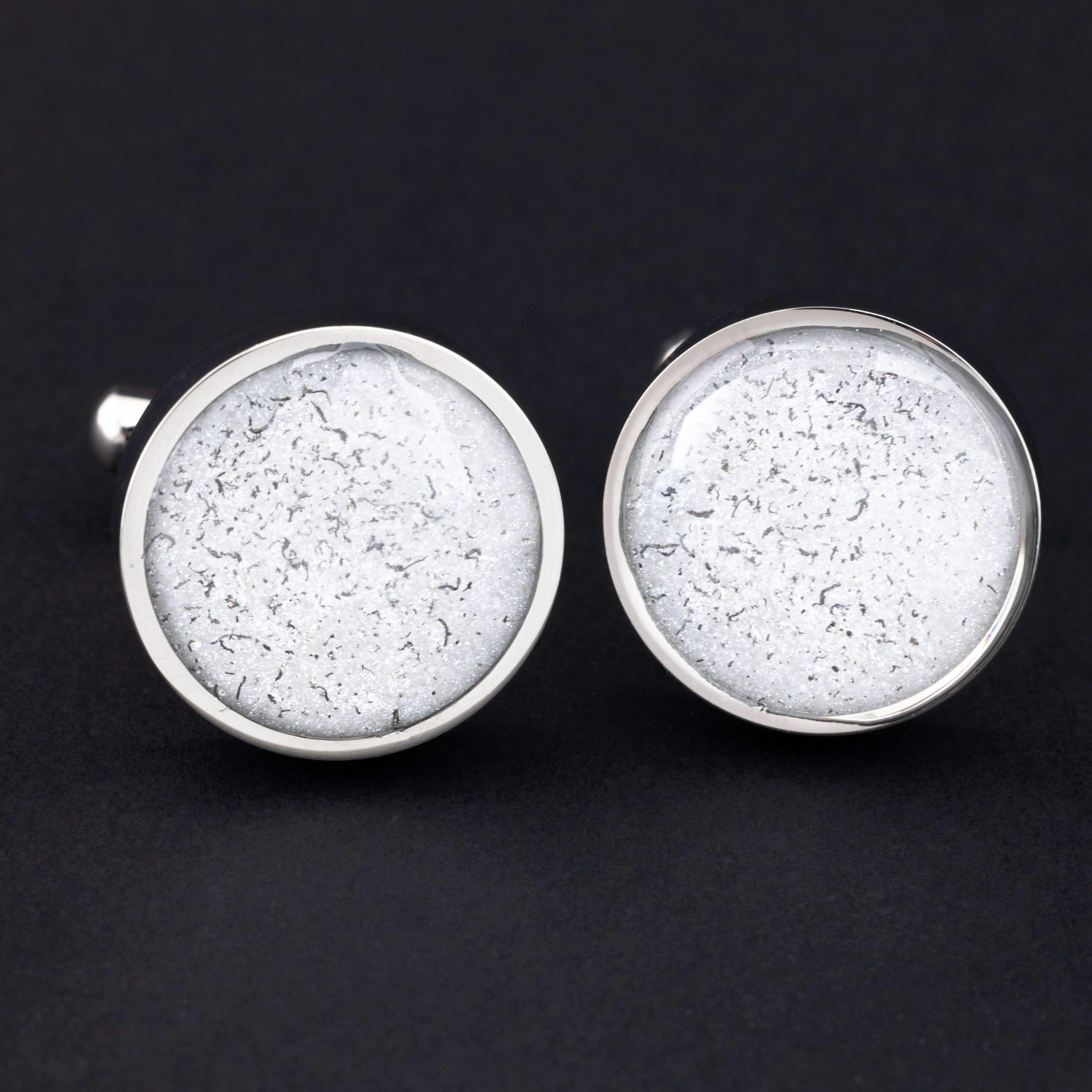 Close-up of the White Meteorite Cufflinks showing Campo Del Cielo iron meteorite set in clean white resin in polished silver-tone stainless steel